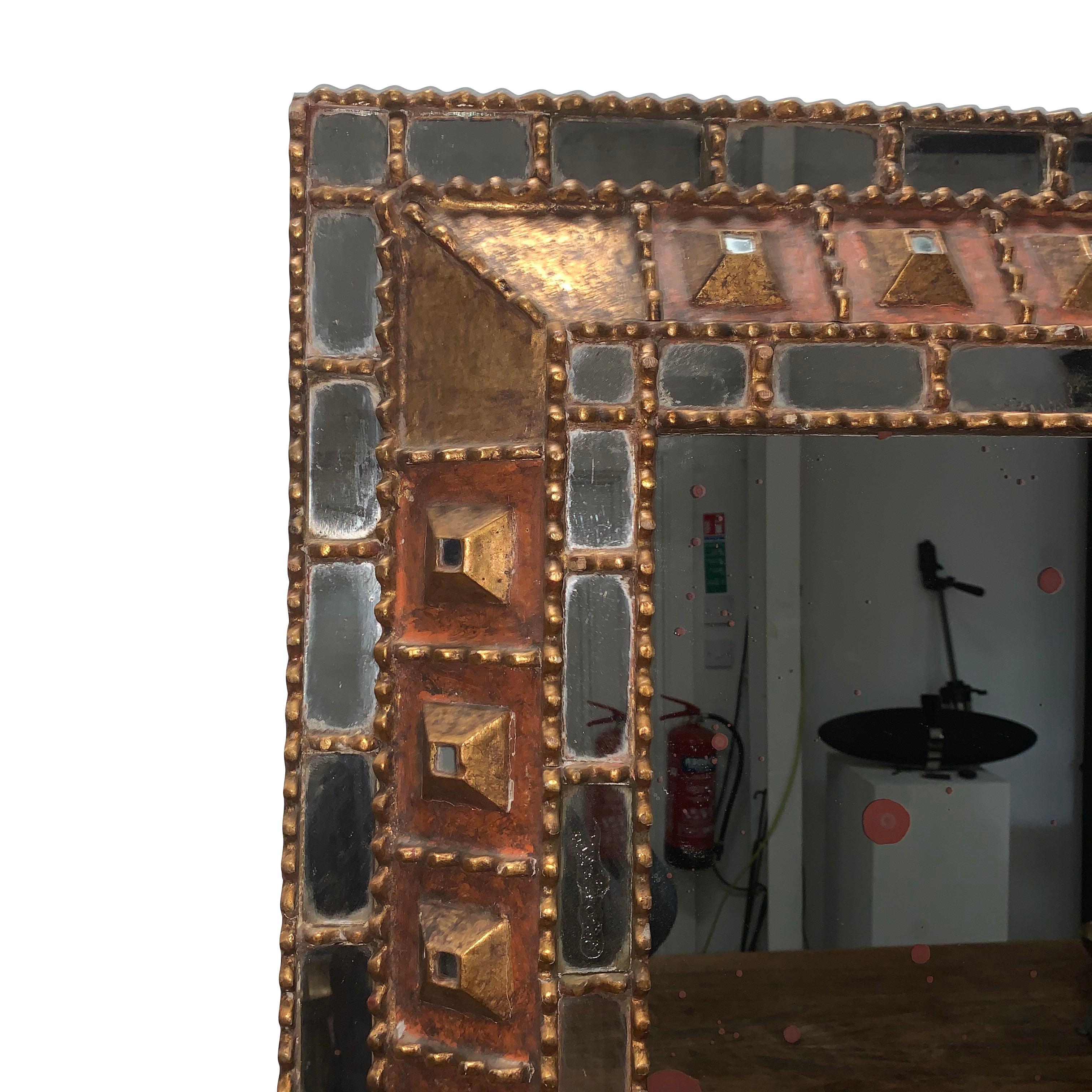 1950s Spanish mirror with carved gold gilt wood and decorative pieced inset mirrors along border of frame
3D design detailing.
 