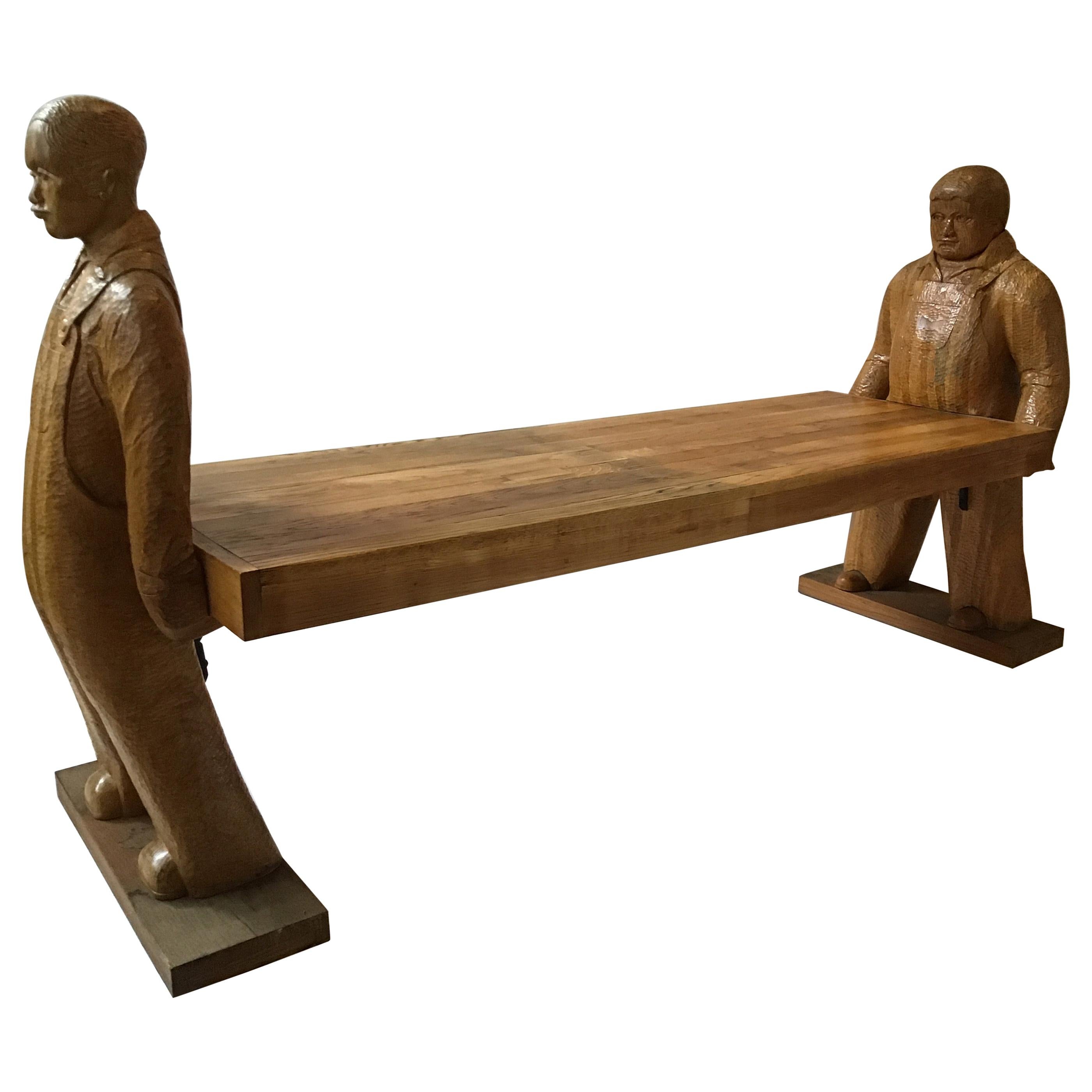 Carved Wood Bench or Table of Two Workers Moving a Piece of Wood