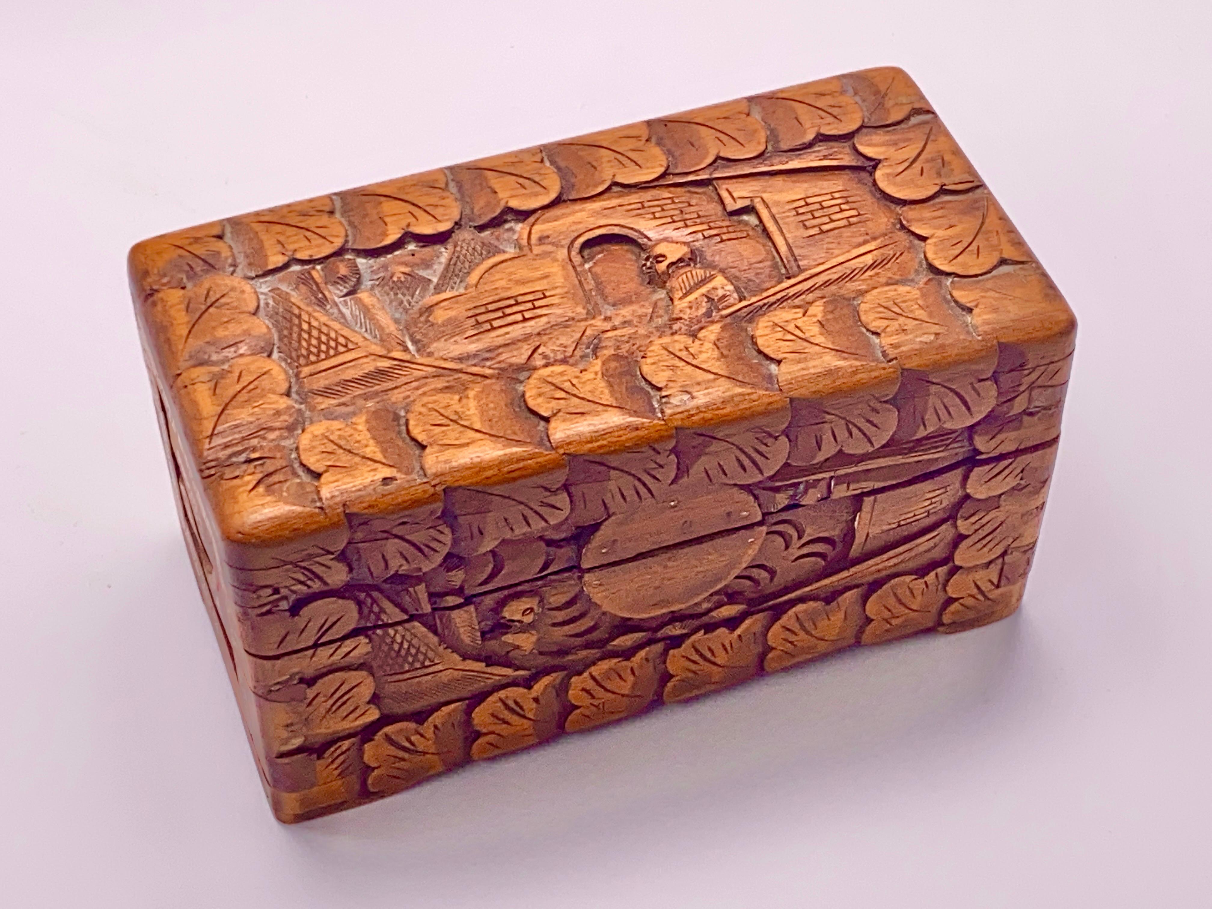 This box is in a brown color. It has been made in the 20th century, in China. It is hand carved, with character and landscapes, patterns.