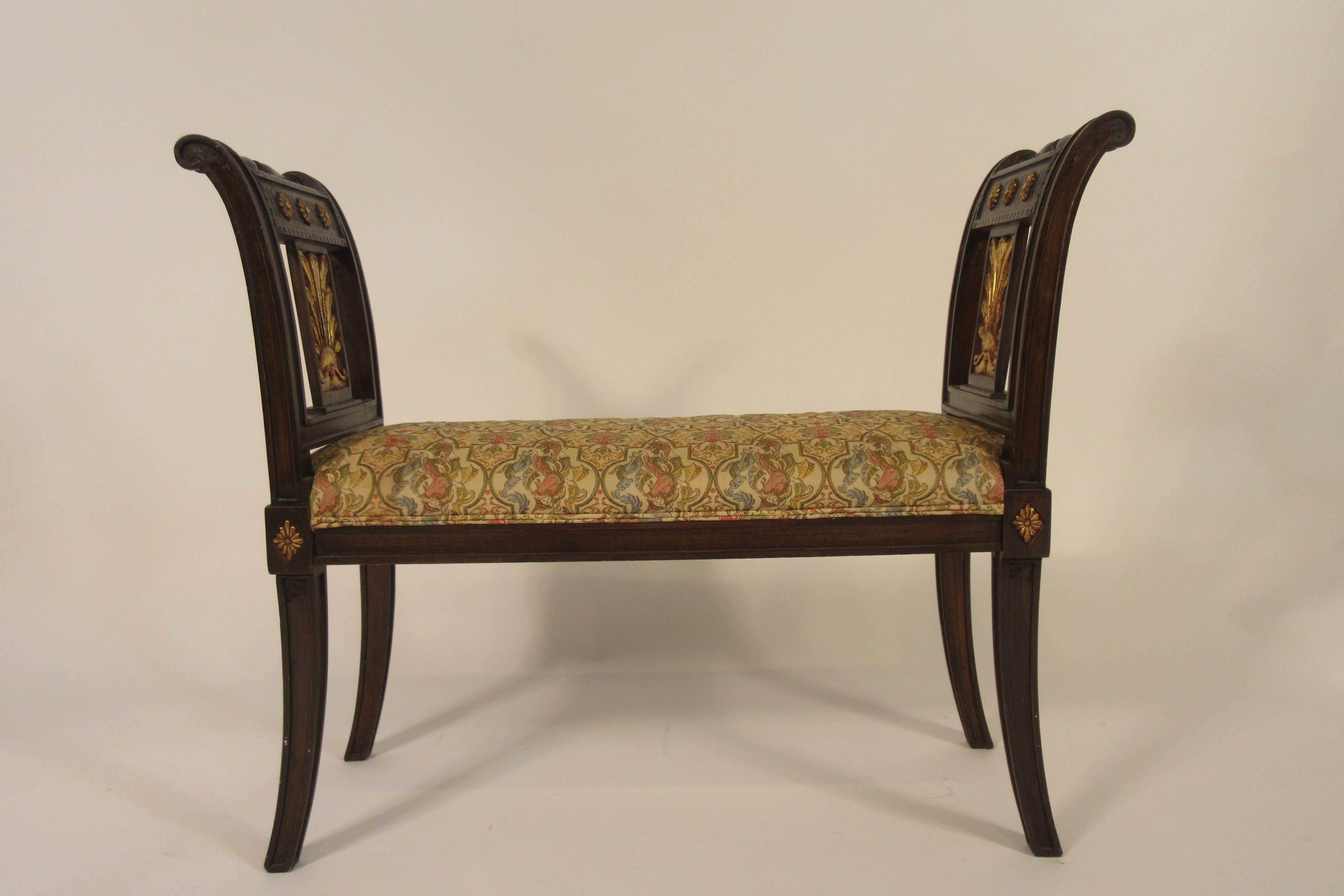 Carved wood classical bench with gilt accents.