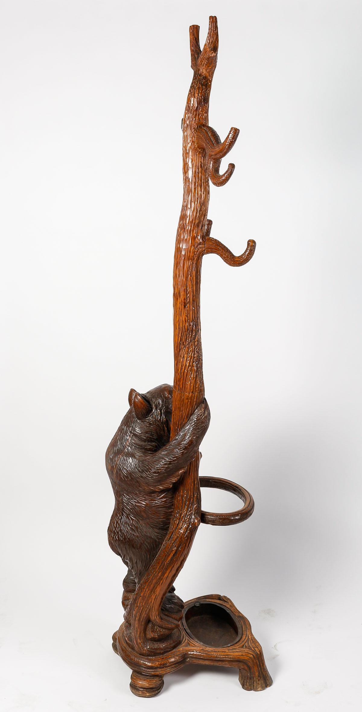 Carved wood coat stand, Napoleon III period, 19th century.

Black forest coat rack, Swiss work, carved wood, Napoleon III period, 19th century.
h: 186cm, w: 57cm, d: 41cm
