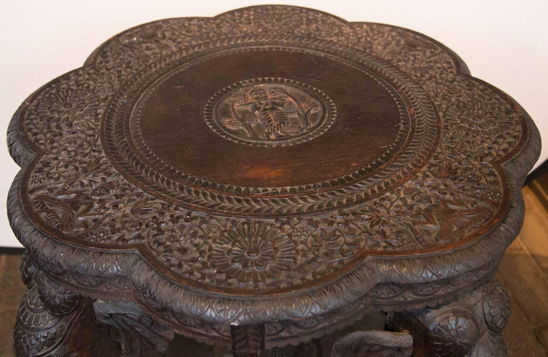 carved wooden elephant table