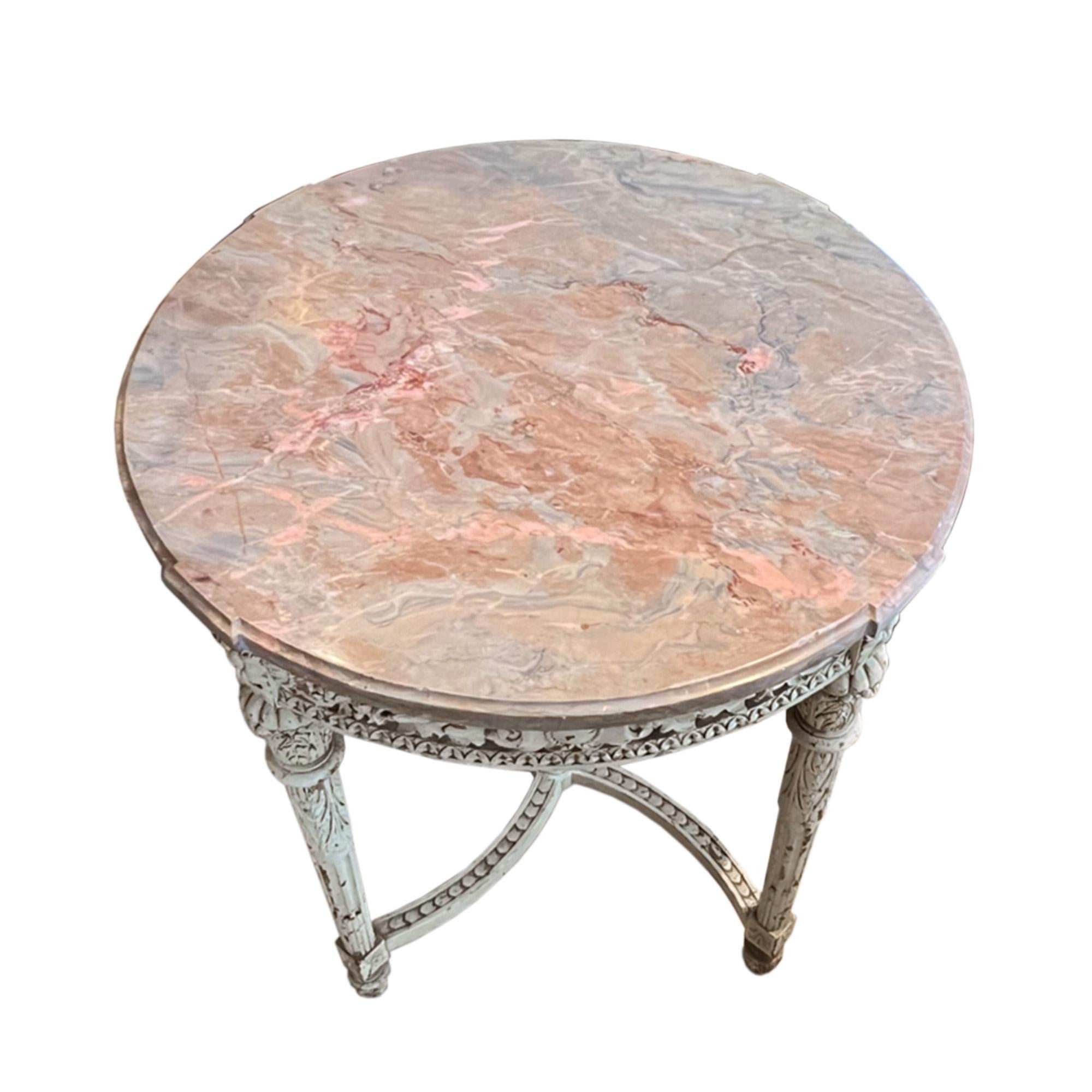 This is a beautiful gueridon with a propeller base - it's made from carved wood with the original paint and has a marble top with a pink hue.

A lovely centre table that was made in France in the 19th century.

Perfect for a hallway, or reception