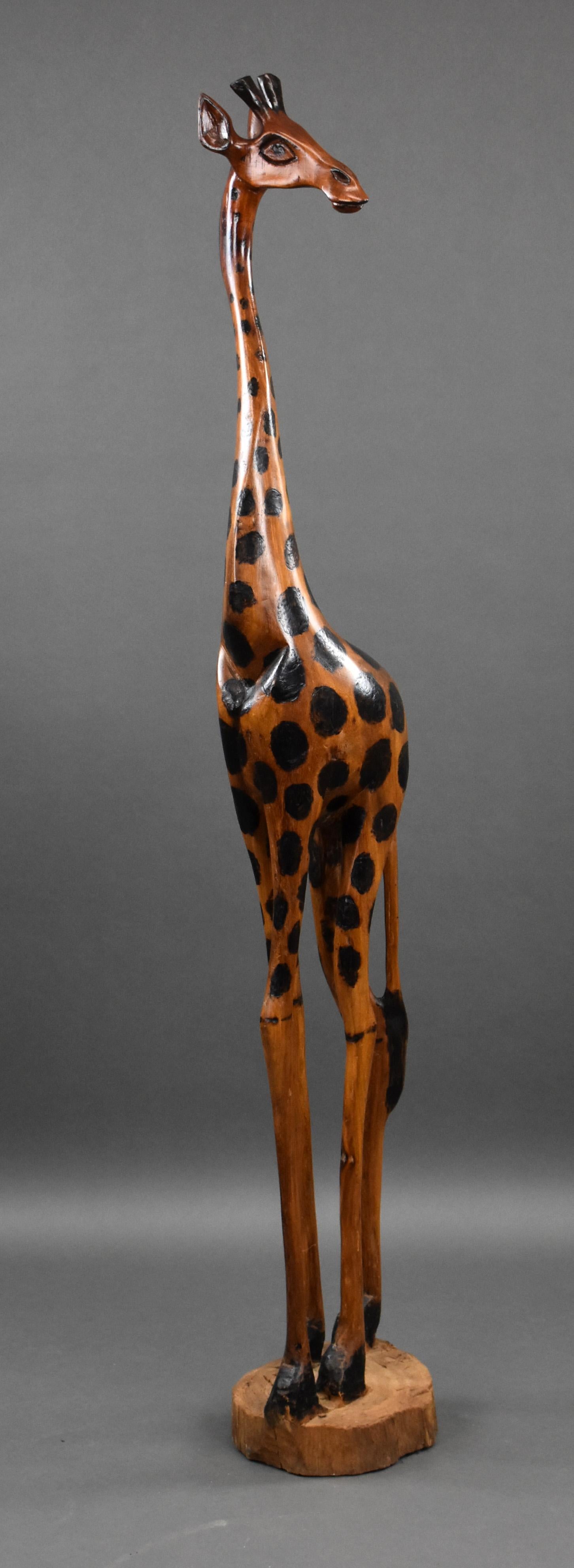 Carved Wood Giraffe standing figure made out of one piece of wood which is possibly Olive wood. Beautifully made and a great addition to any room.

Dimensions