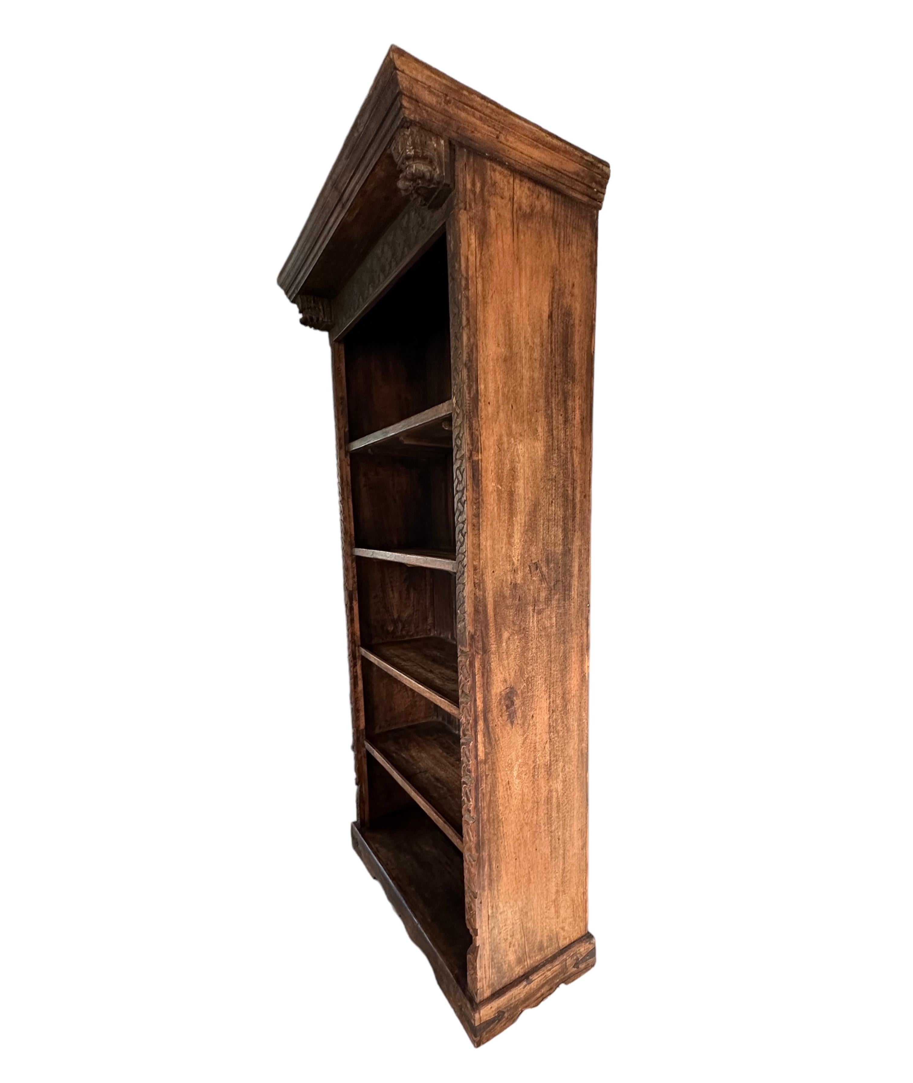 This is a  beautiful book-case, hand carved decorative trim in face of unit and from India. It has a beautifully aged patina. It’s is only been in the hands of one owner.
Wonderful piece for objects books and could be used in many different areas of