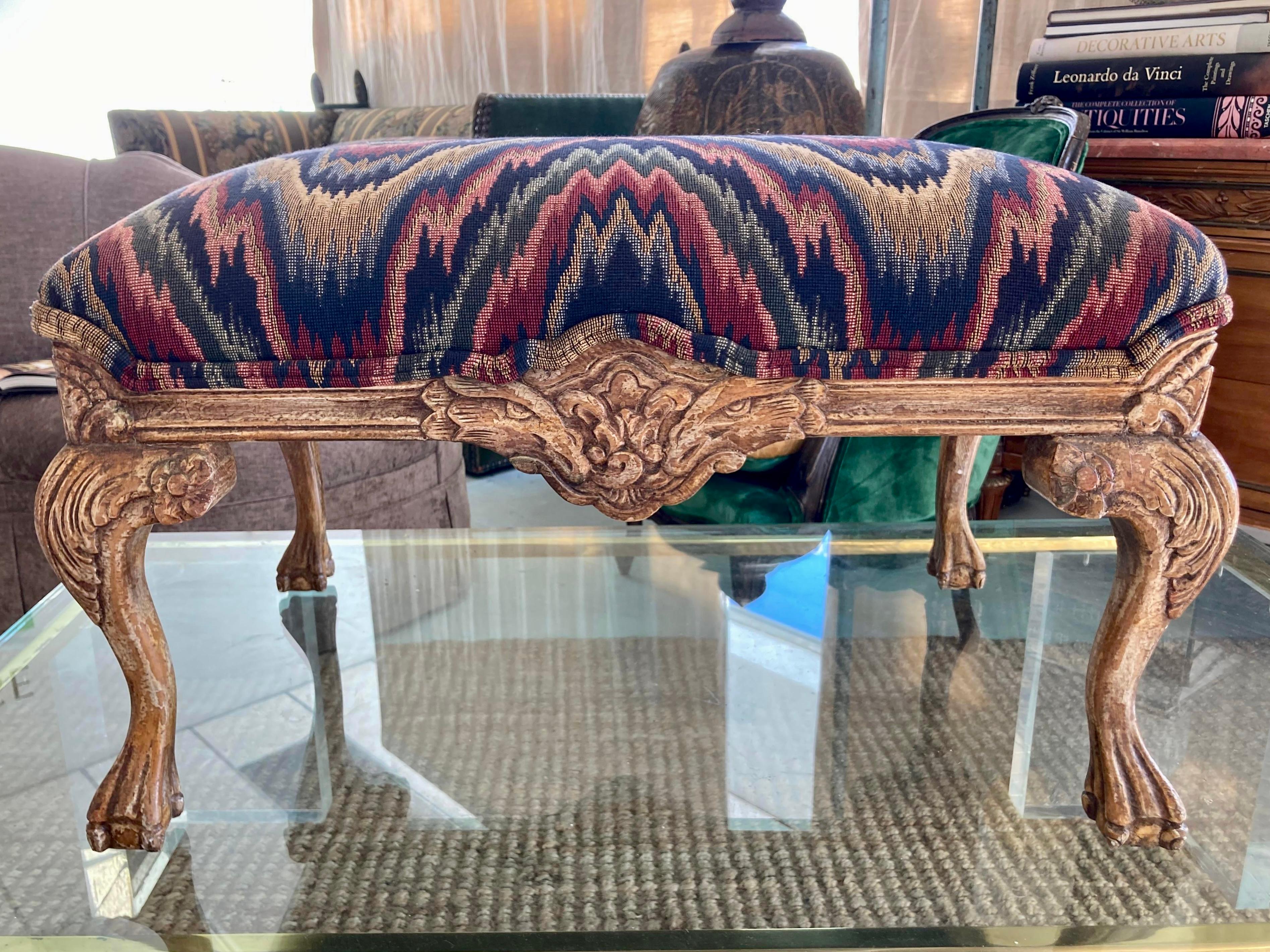 Beautiful Italian hand carved wood frame upholstered ottoman. We have 2 in inventory so collect both. Original painted finish that highlights the carving details. Nice quality upholstery work, too. Add some Italian style to your home.