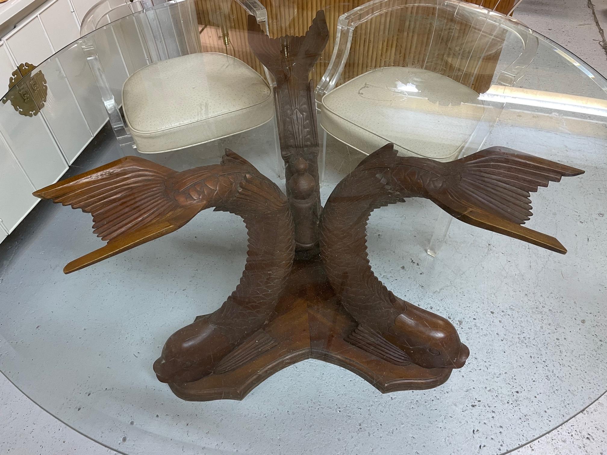 Carved wood Koi fish pedestal dining table with round glass top. Base alone measures 34