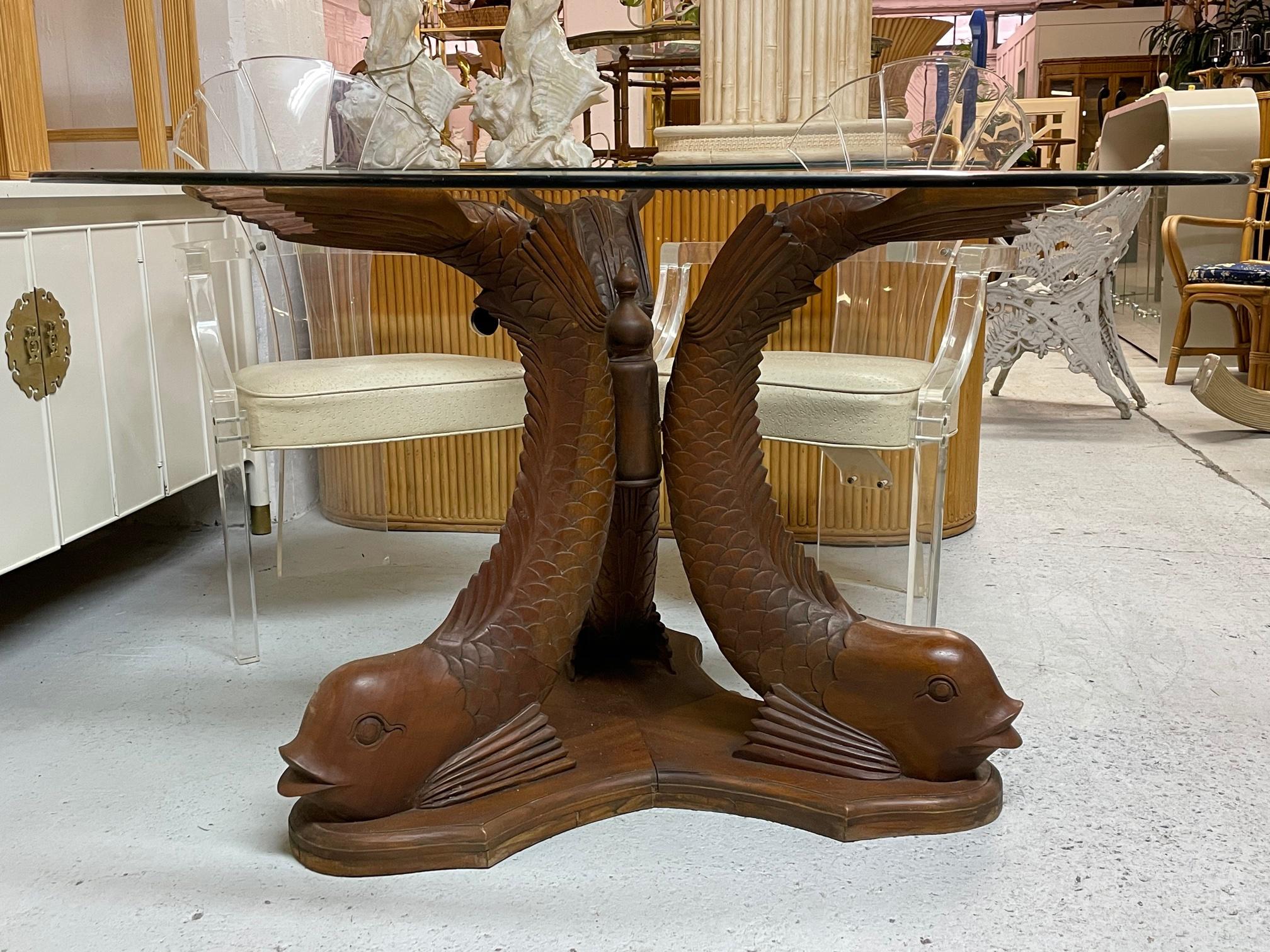 Carved wood Koi fish pedestal dining table with round glass top. Base alone measures 34