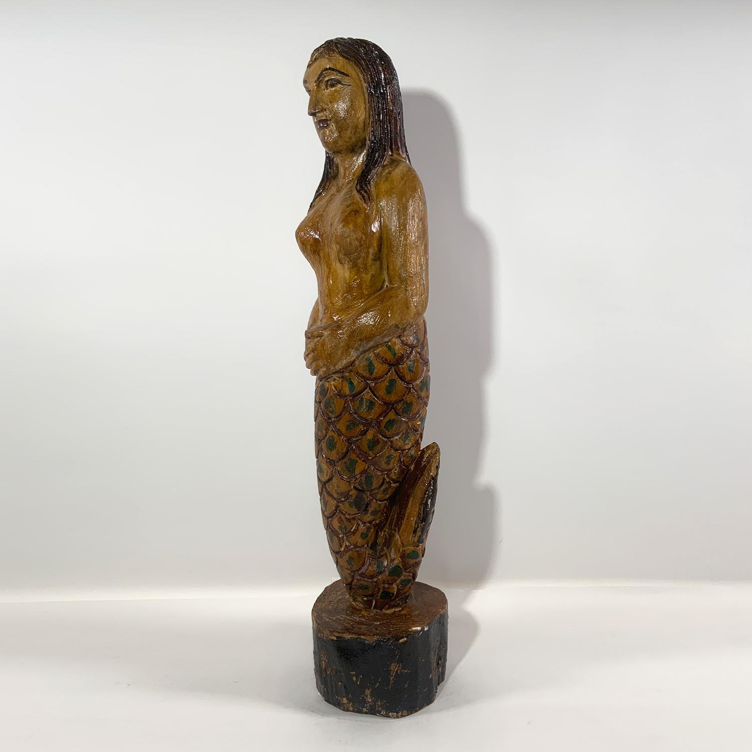 wooden mermaid statue