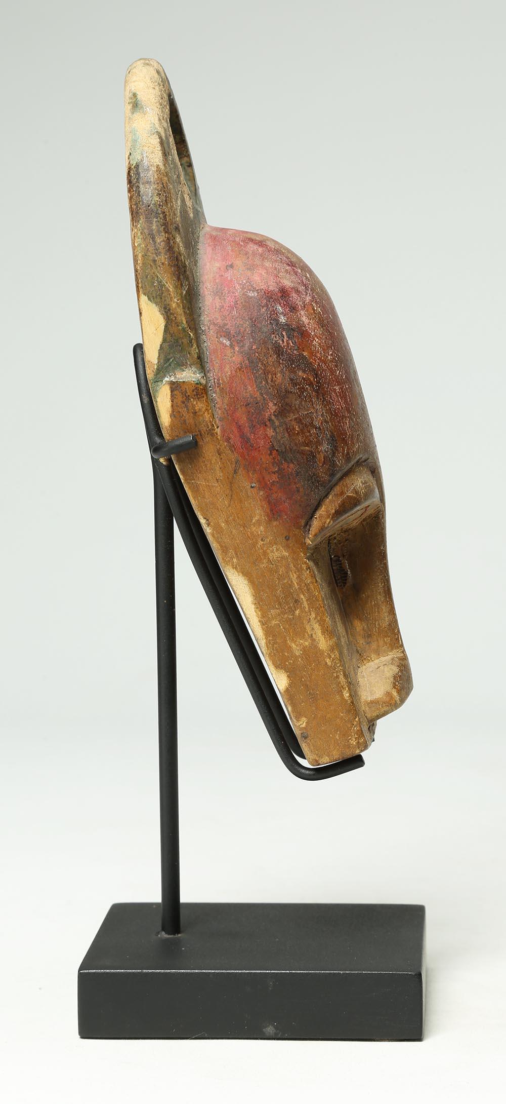 Tribal Carved Wood Miniature Baule Bush cow Mask Stand Ivory Coast Early 20th Century For Sale