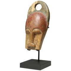 Miniatura in legno intagliato Baule Bush, supporto per maschera della mucca della Costa d'Avorio, inizio XX secolo