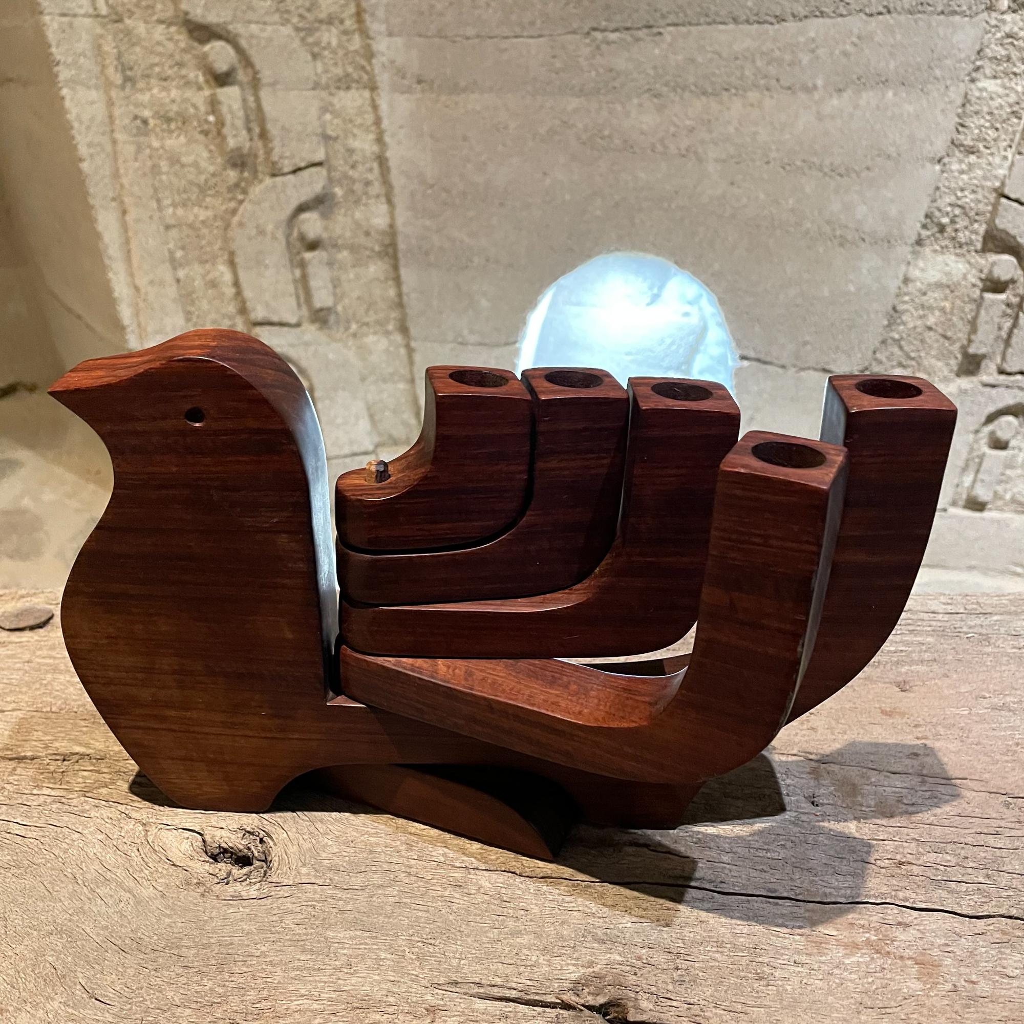 Modern peace dove splayed 5 arm candle holder in carved cocobolo hard wood attributed to Don Shoemaker Mexico 1970s
Unmarked. No signature.
Measures: 6.5tall x 10.5w x 1.5d inches
Unrestored preowned vintage presentation and condition.
Please