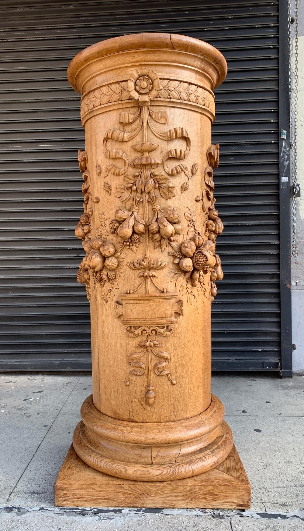 Stunningly beautiful is this carved pedestal hand made in France in the mid 1800's by Master sculptor and artist P.Mazaroz R.

The piece is heavily carved having flowers, fruits and vegetables along with some ribbons and scrolls.

The piece is
