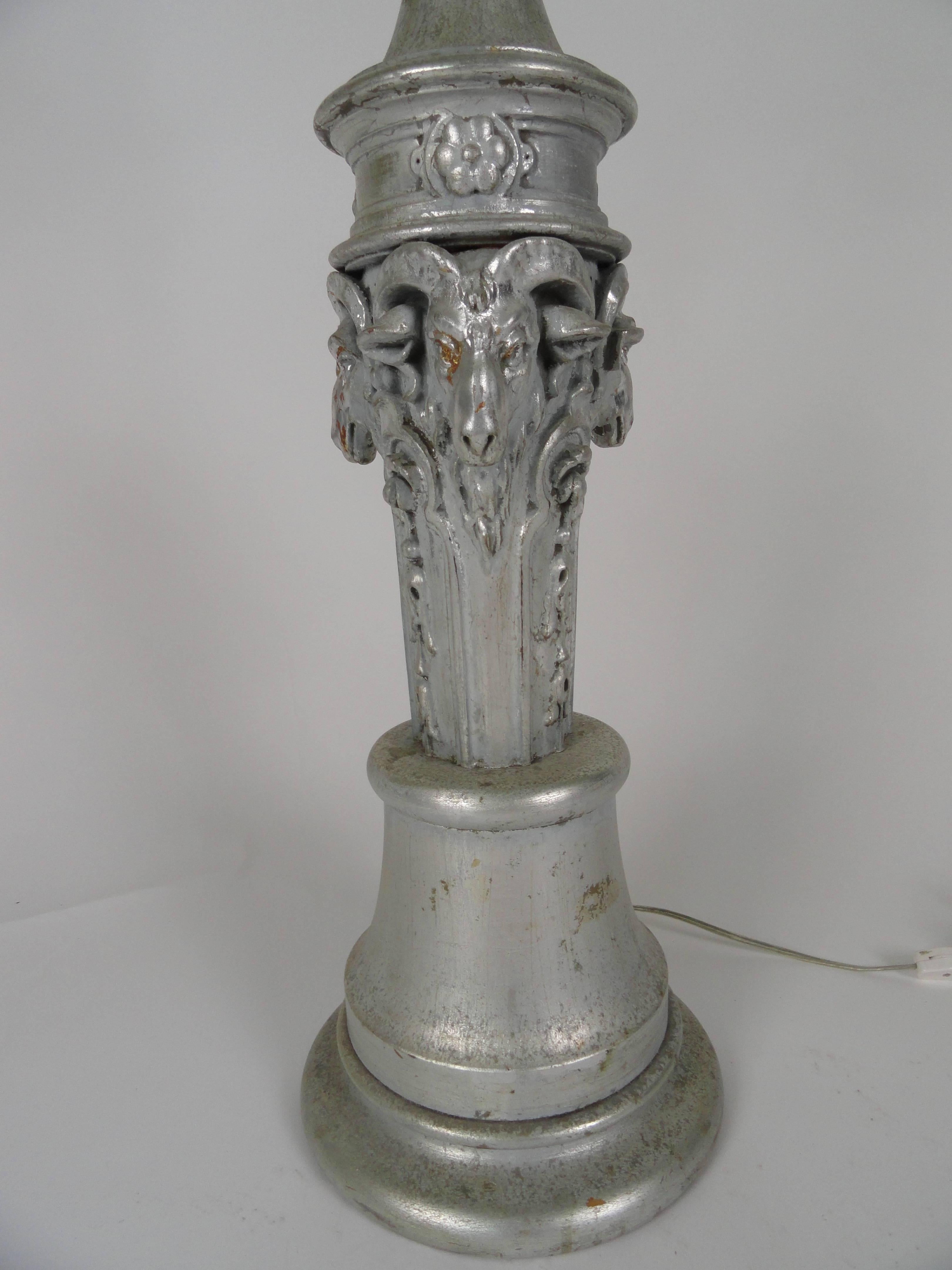 Large scale carved wood, silver finish lamp with ram's head detail lamp. Unique lamp with beautifully carved rams heads. New wired with inline switch.