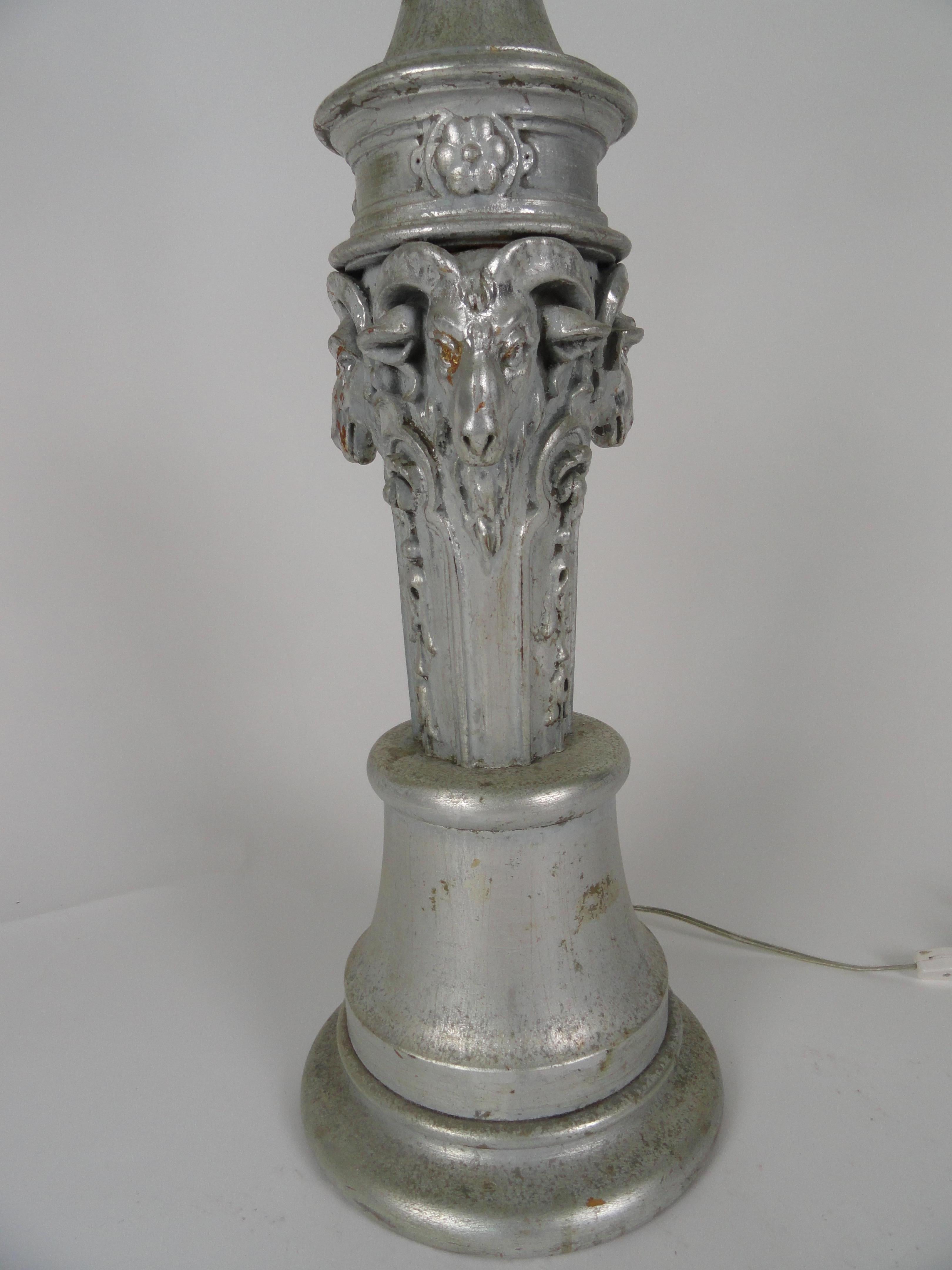 Large-scale carved wood, silver finish lamp with ram's head detail lamp. Unique lamp with beautifully carved rams heads. Newly wired with inline switch.