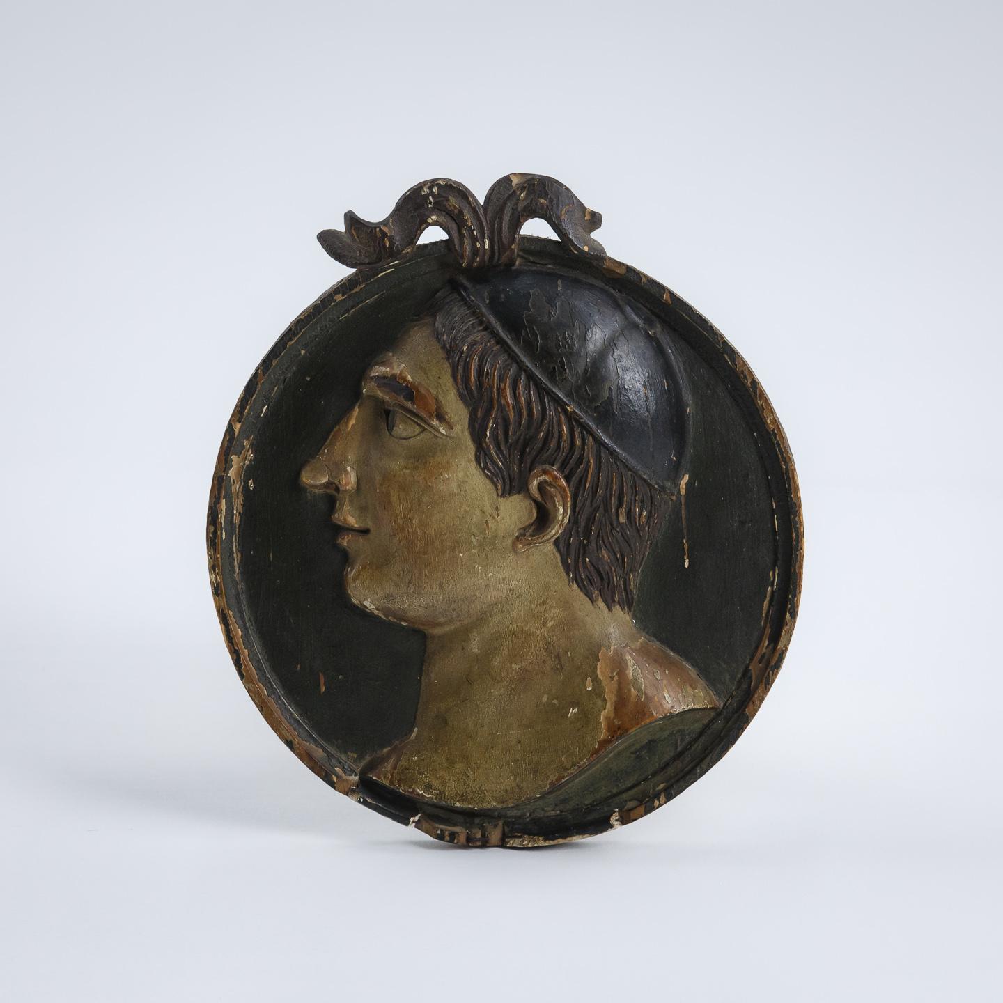 Impressive, carved wood and original polychromed relief portrait tablet of a young Roman man. Wearing a pileus, or brimless felt cap. Italy, Circa 1700.
