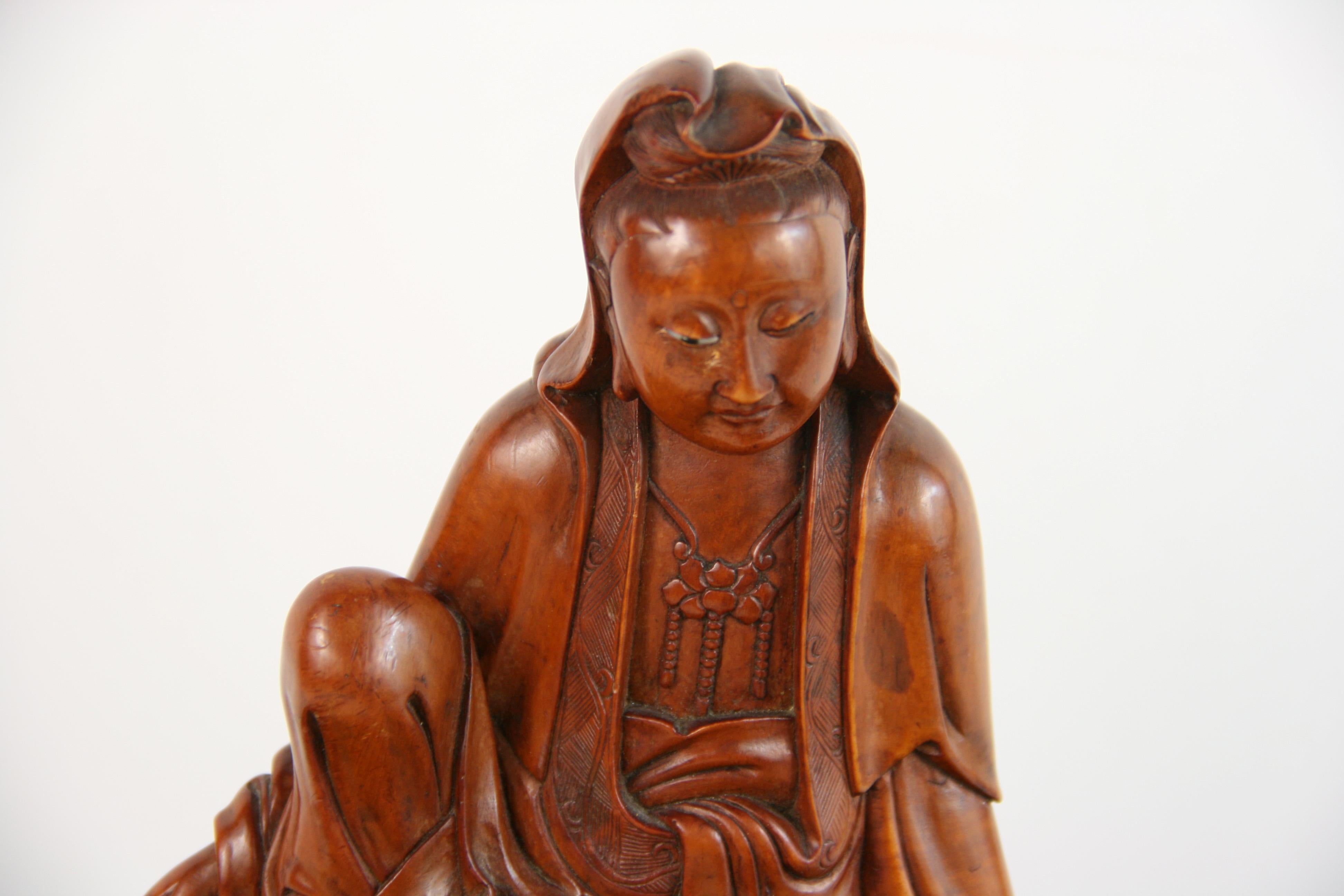 Carved Boxwood Figure of Guangin on Wood Base, 19th Century In Good Condition In Douglas Manor, NY