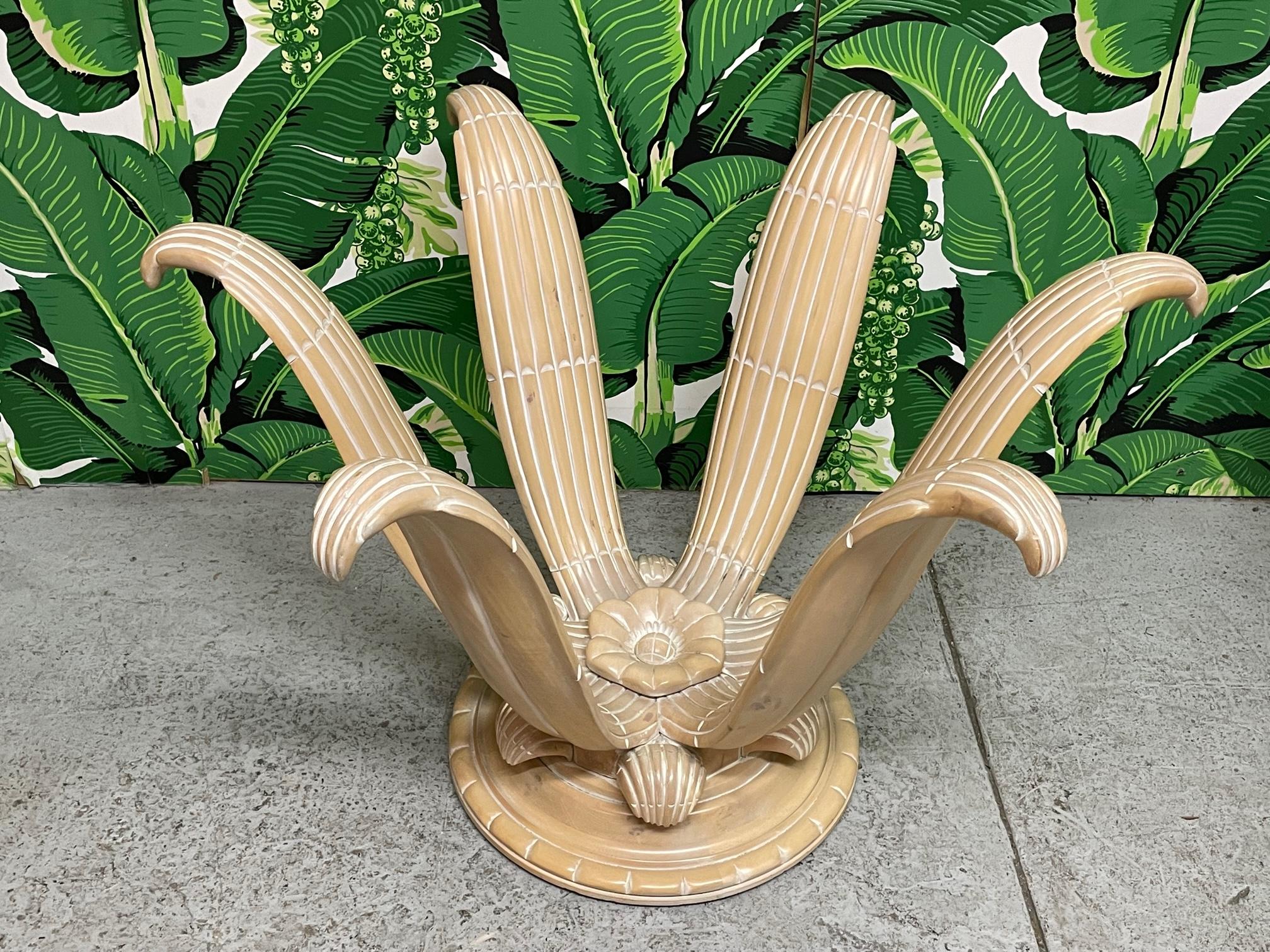 Carved dining table base features a sculptural floral design. Can support glass tops from 46