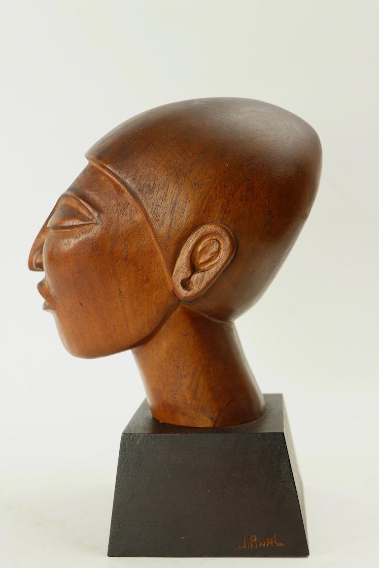 Modernist carved wood bust of Mexican woman by noted artist Jose Pinal. This figure is my personal favourite of his oeuvre. This example is in very fine, original condition, fully and correctly marked.
