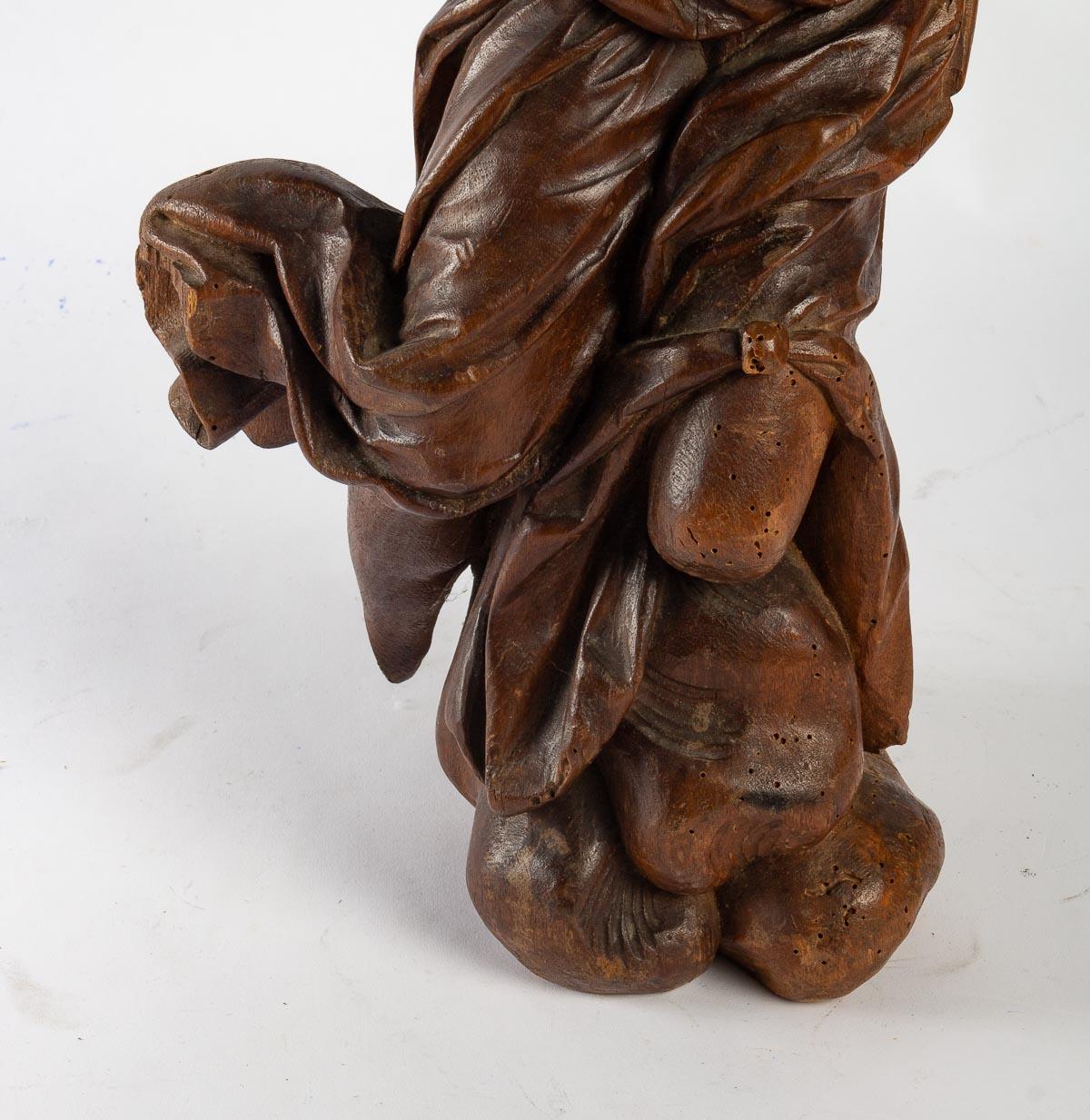 Scultura in legno intagliato del XIX secolo.
Misure: H: 54 cm, L: 26 cm, P: 18 cm.