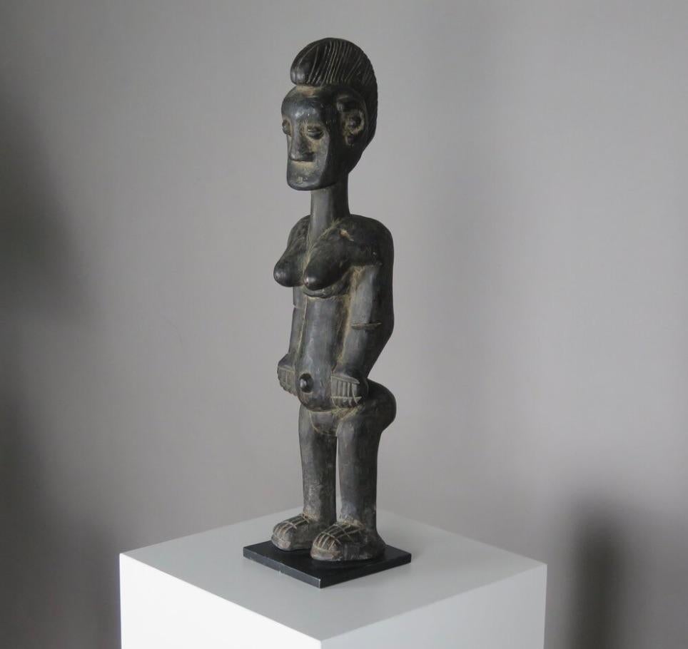 Late 20th Century Carved Wood 'Senufo' Statue on Stand For Sale