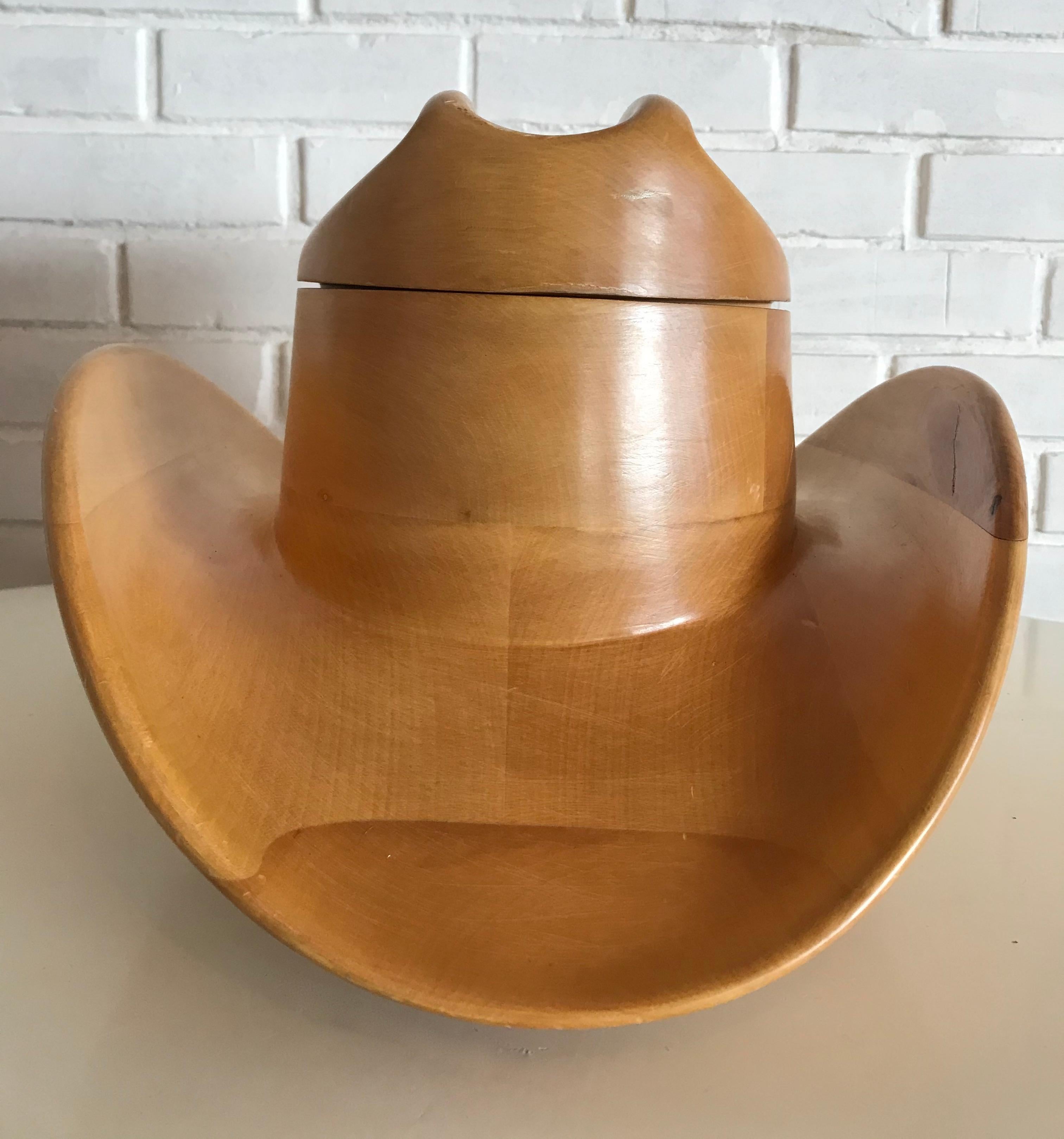 Beautiful wood carved ice bucket cowboy hat made by Alfonso Bini Firenze (Venice), Italy.
The BINI logo is marked at the bottom of the ice bucket hat. x.

 