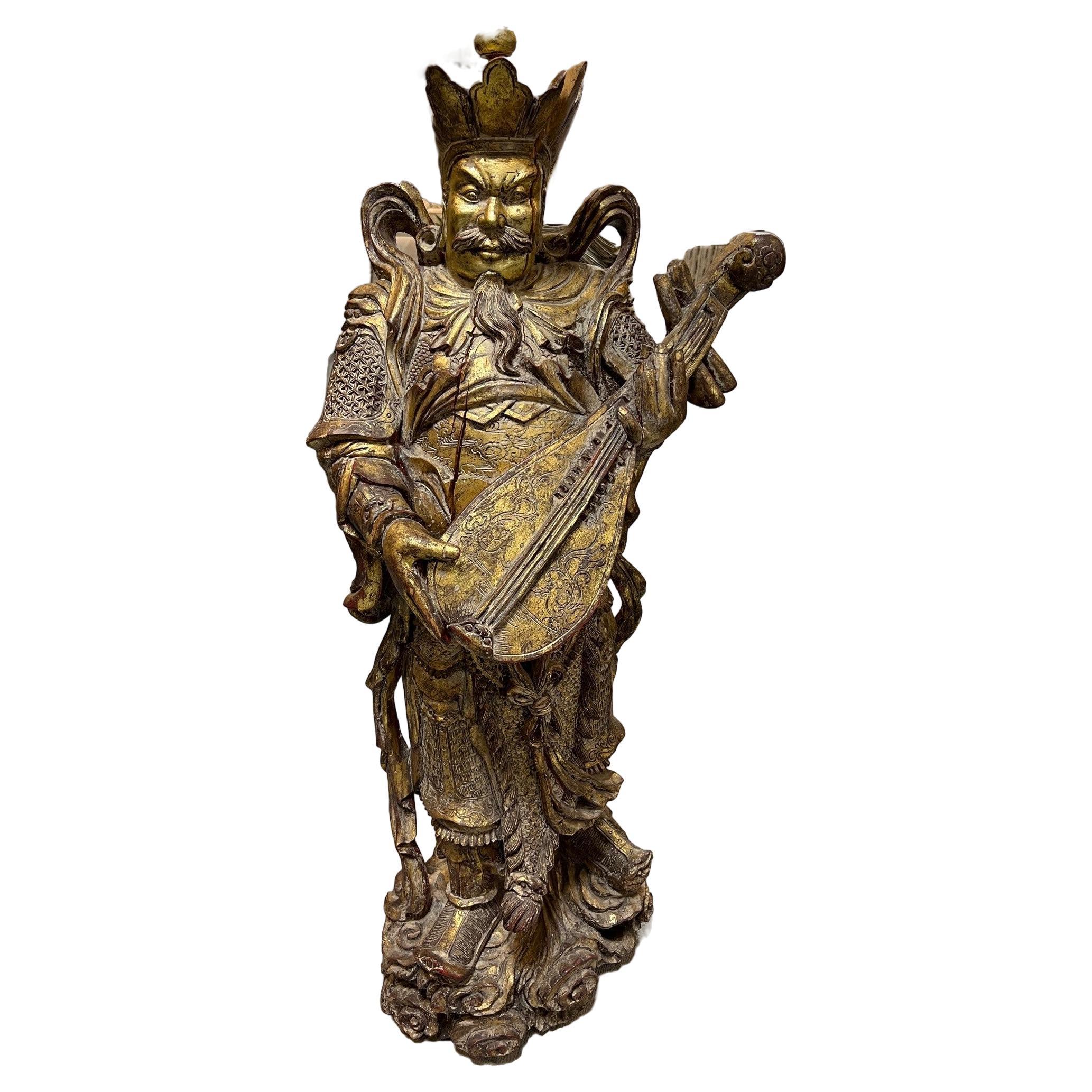 Carved Wood Tibetan Warrior Temple God Playing a Liuqin or Mandolin   For Sale