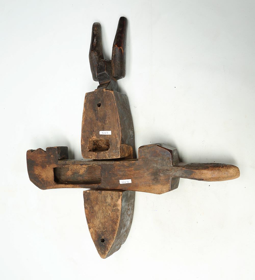 Well-used wood door lock used by the Bambara people, Mali, Africa, with crosspiece. The top is an animal head with horns. Includes original movable bolt or crosspiece. Heavy wear and encrusted patina from extensive use. Stylized head with horns on