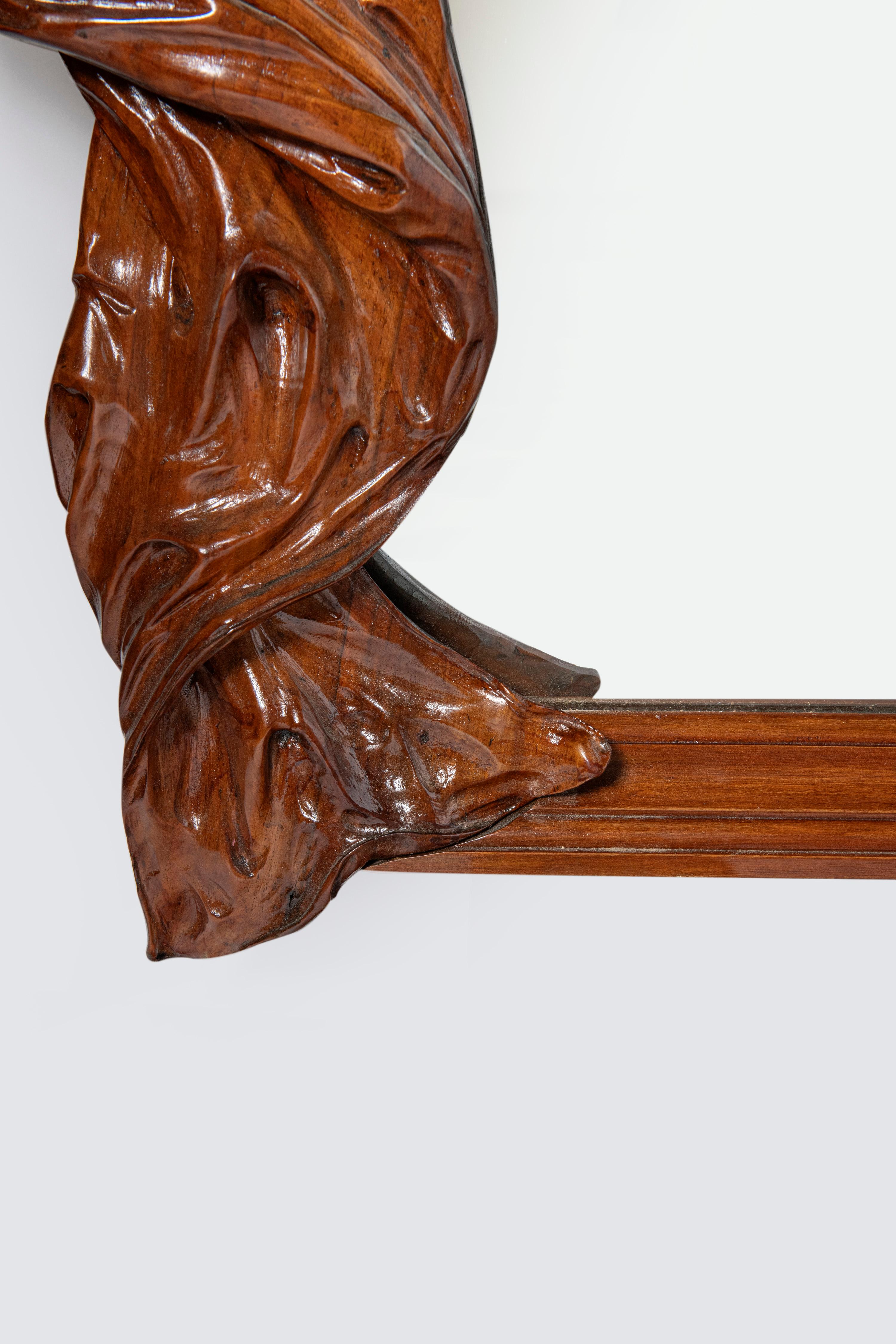 20th Century Carved wood wall mirror, Art Nouveau period. France, early 20th century. For Sale