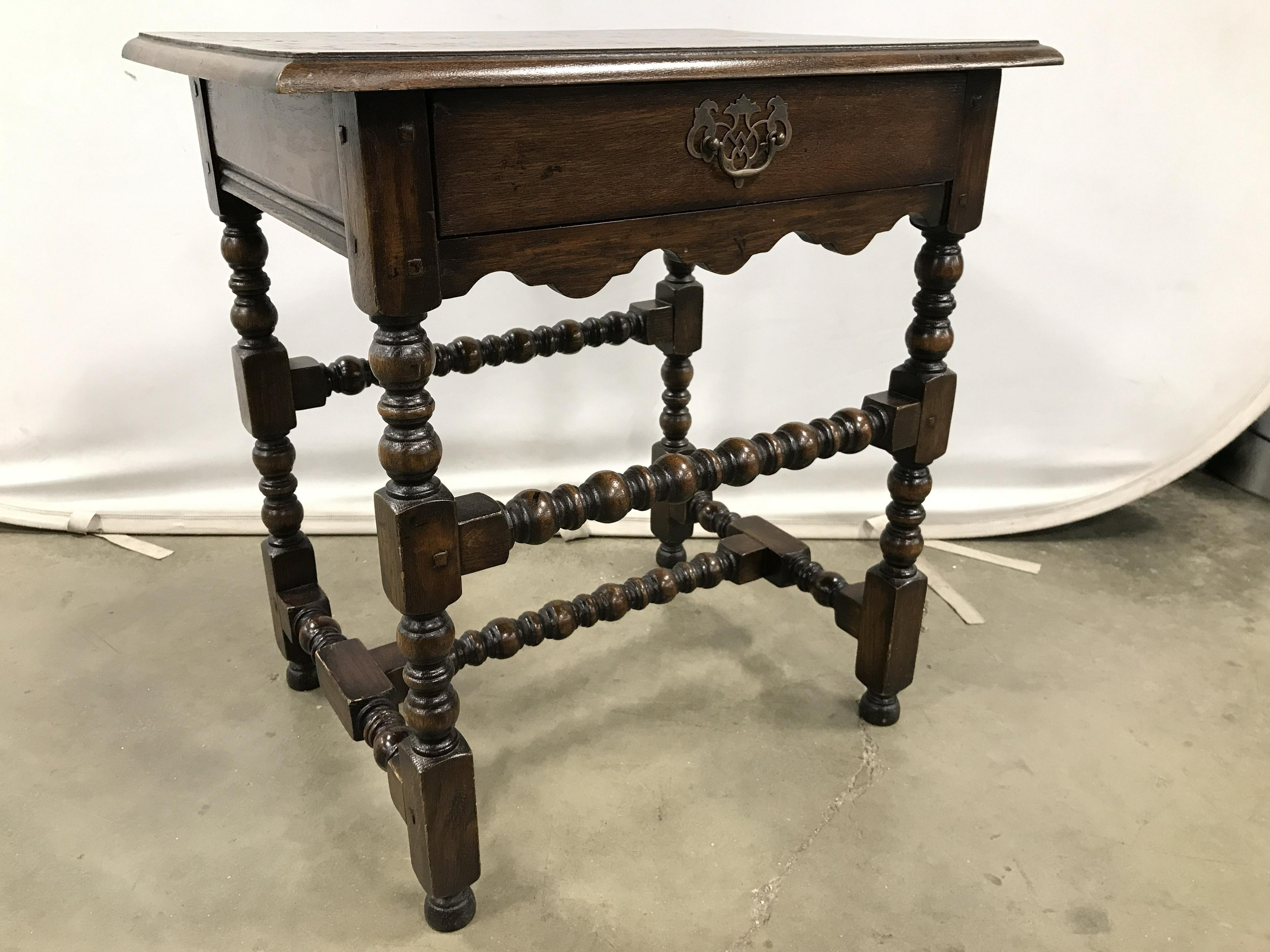 Antique French side table with one dovetailed drawer and intricately carved barley twist legs and stretchers. Brass drawer pull. Table has wonderful aged patina.
Search terms: Side table, wooden side table, end table, side table with drawer,
