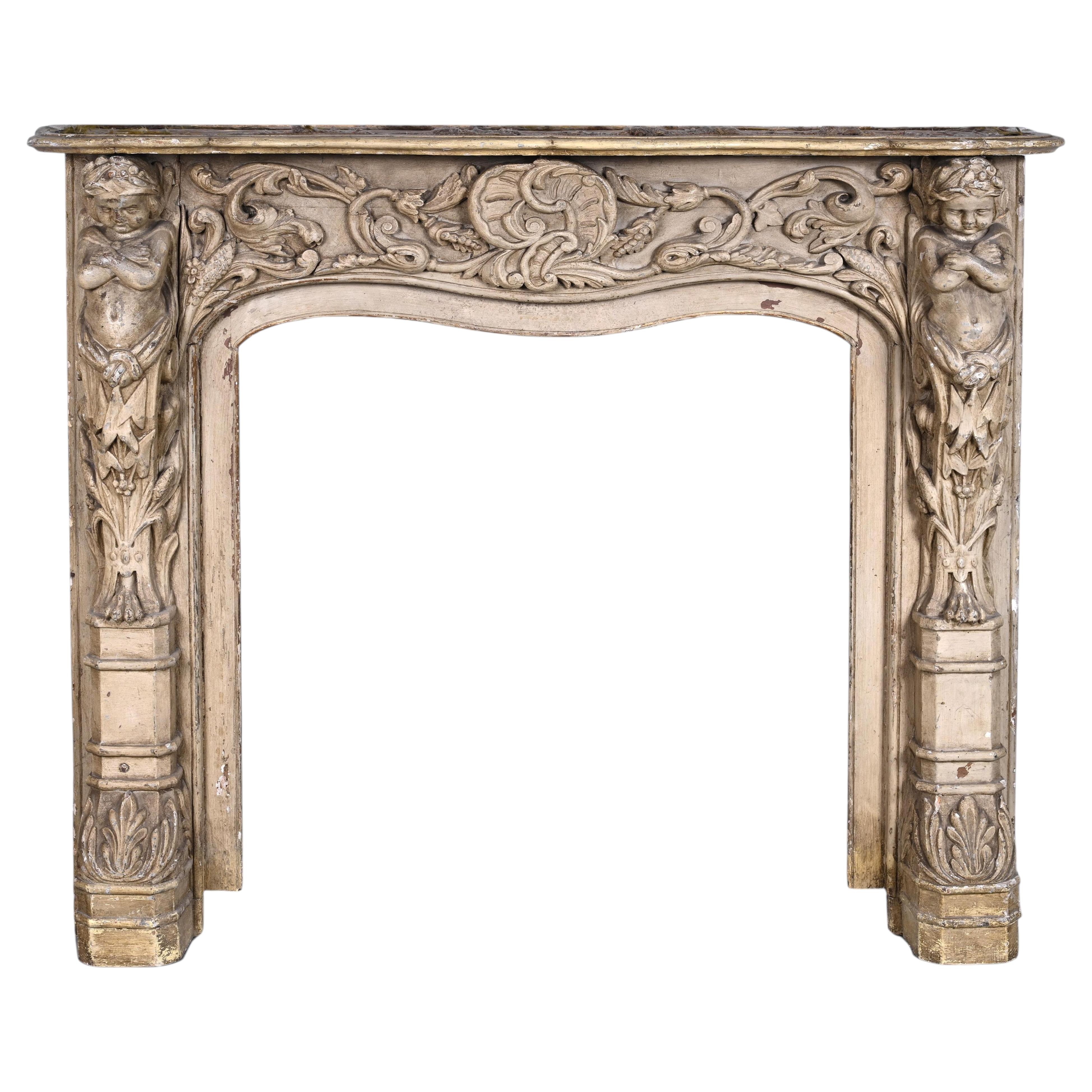 Carved wooden fireplace with putti decoration – Late 18th century For Sale
