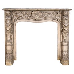 Carved wooden fireplace with putti decoration – Late 18th century