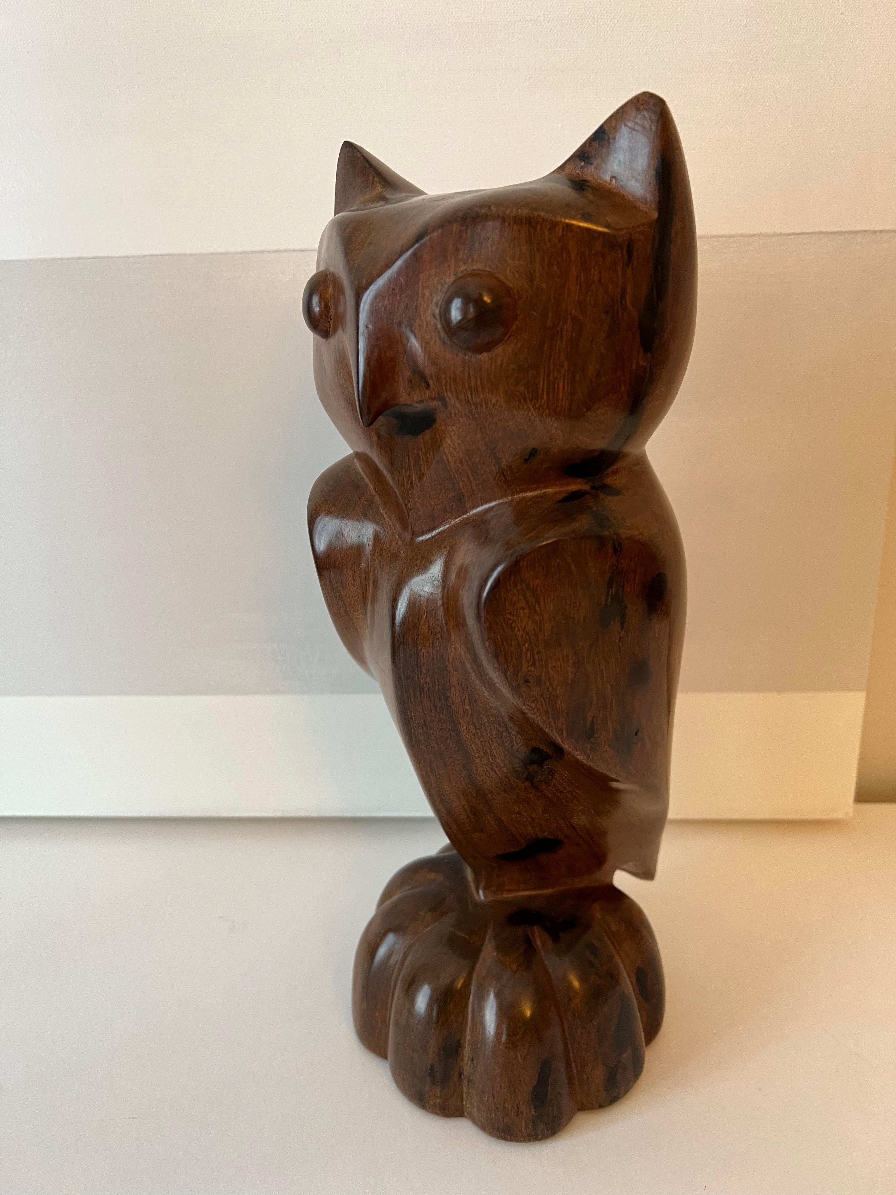 Hand-carved owl sculpture of hardwood - perfectly carved and finished to a rich lustrous sheen. Perfect for any shelf as a focal point or added to books and art.