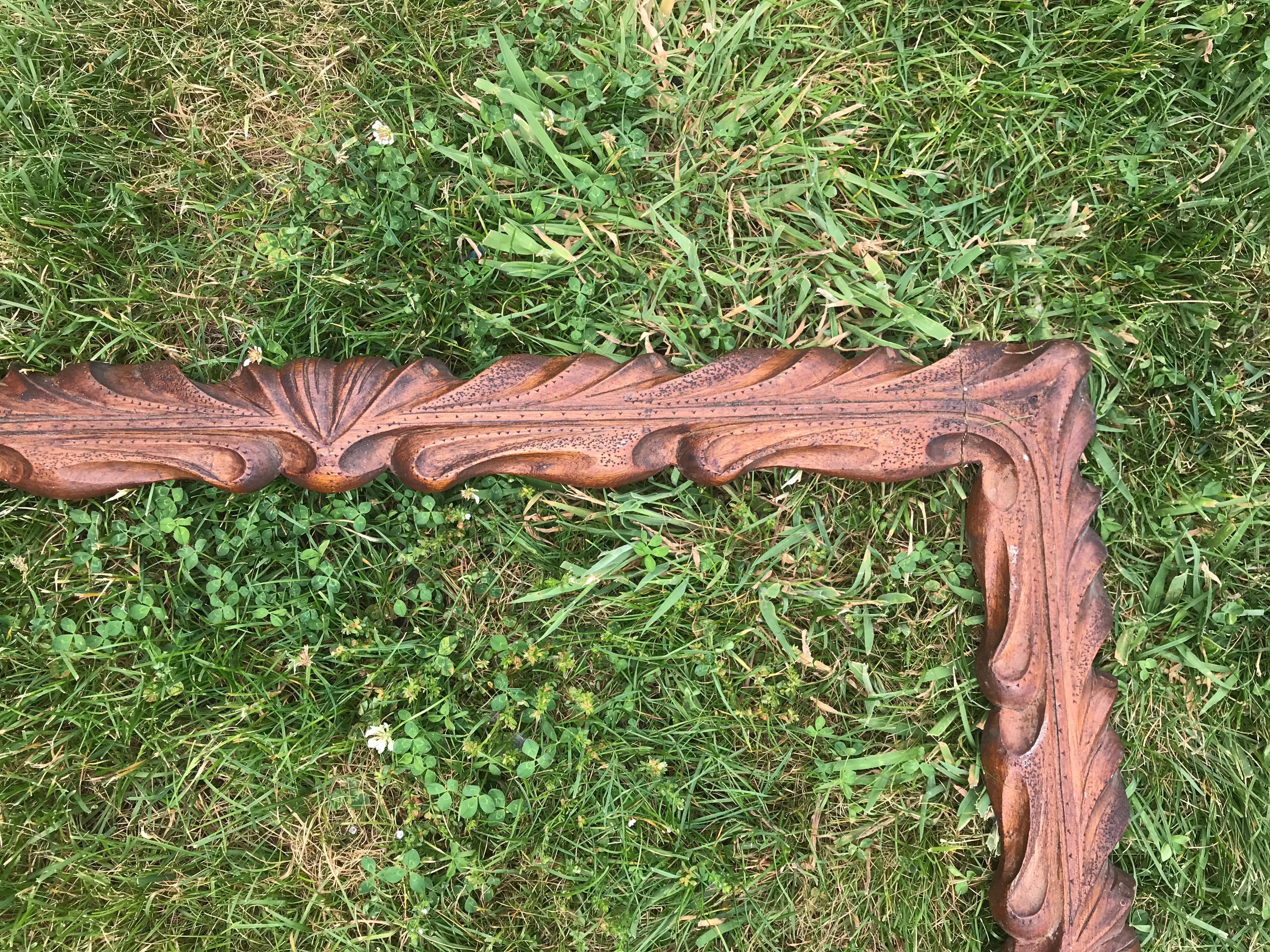 Carved wooden frame.