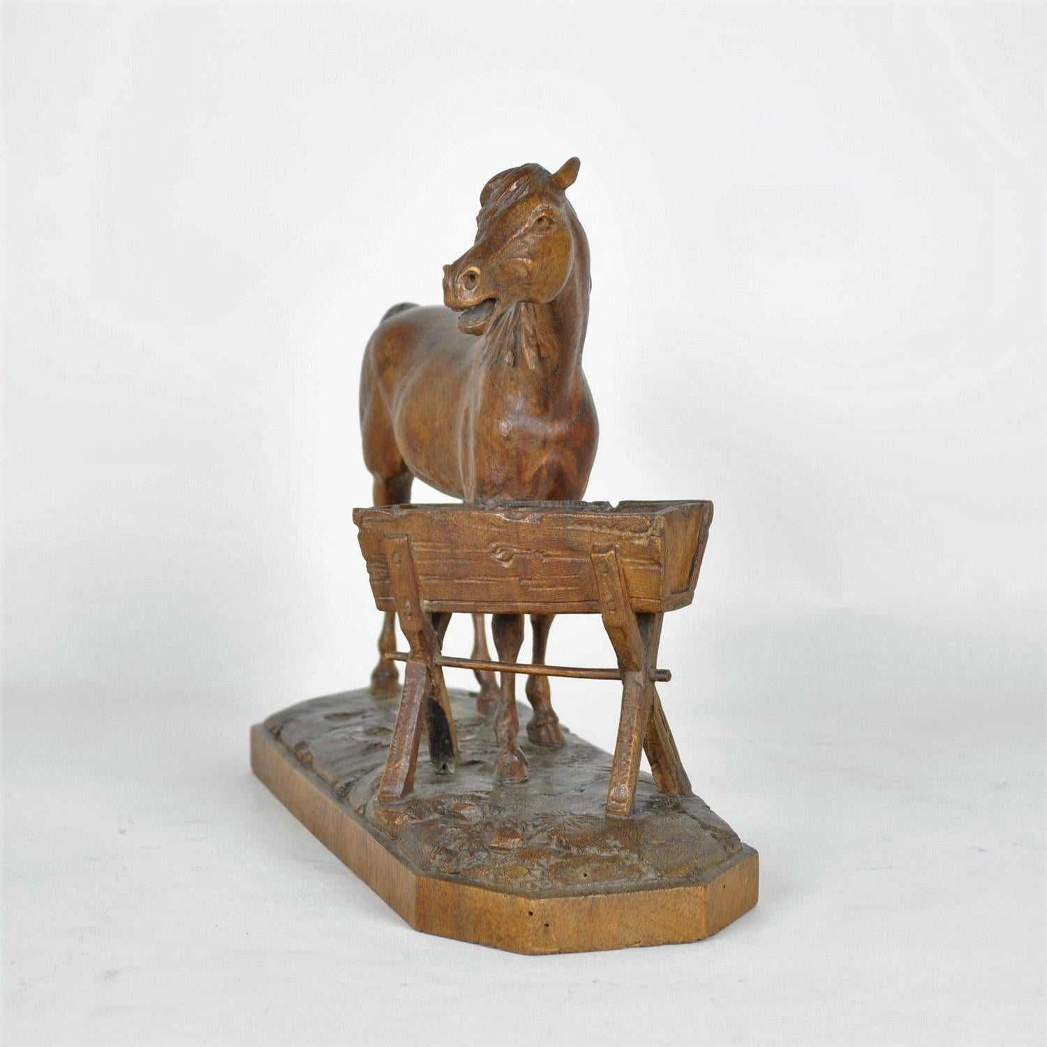 carved wood horse