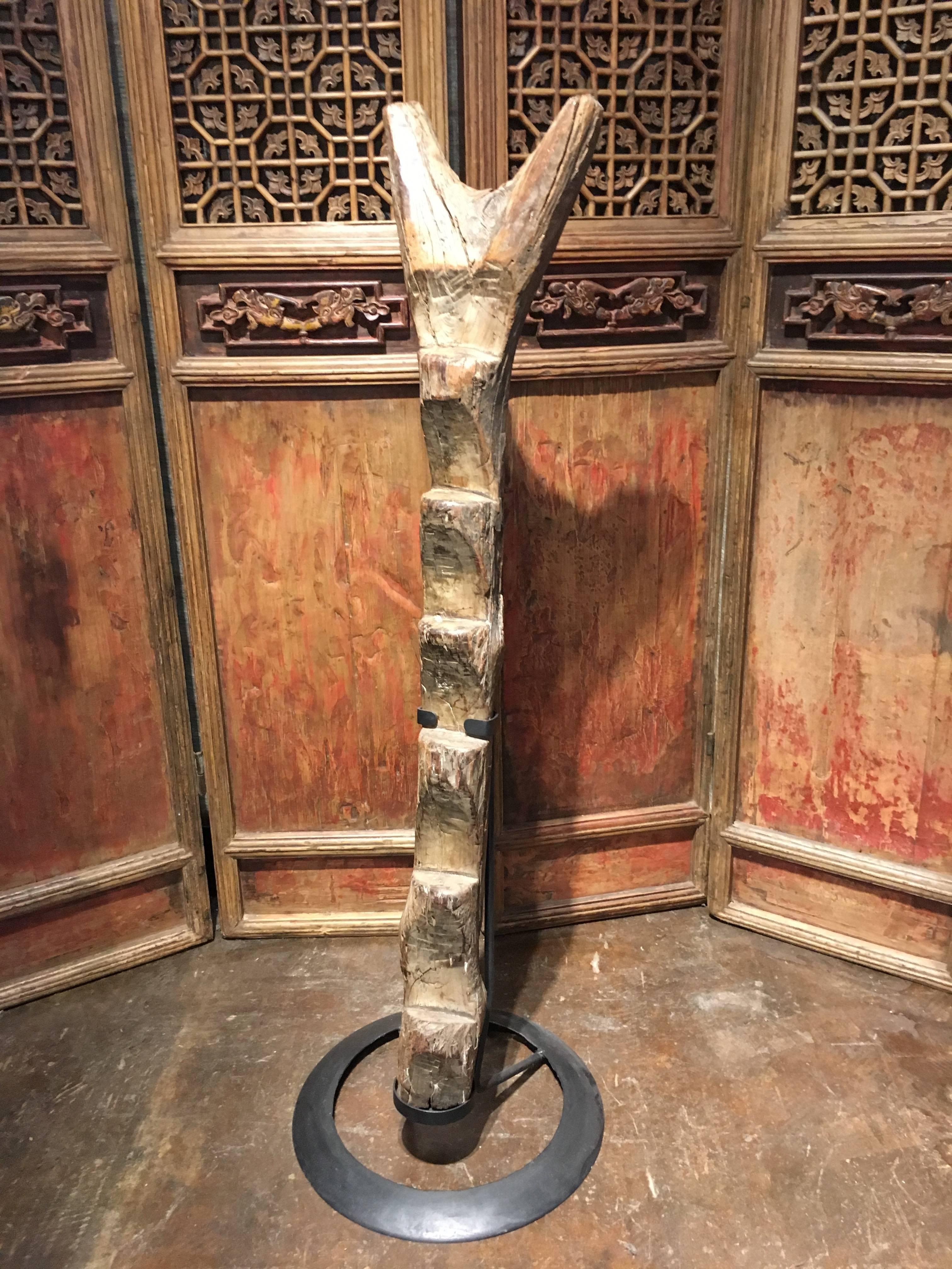A well carved an well used Dogon wooden ladder, Mali, 20th century or earlier.
The ladder carved from a single large tree trunk, with deep footholds showing nice wear and patina from use. The anthropomorphic forked top also well carved and