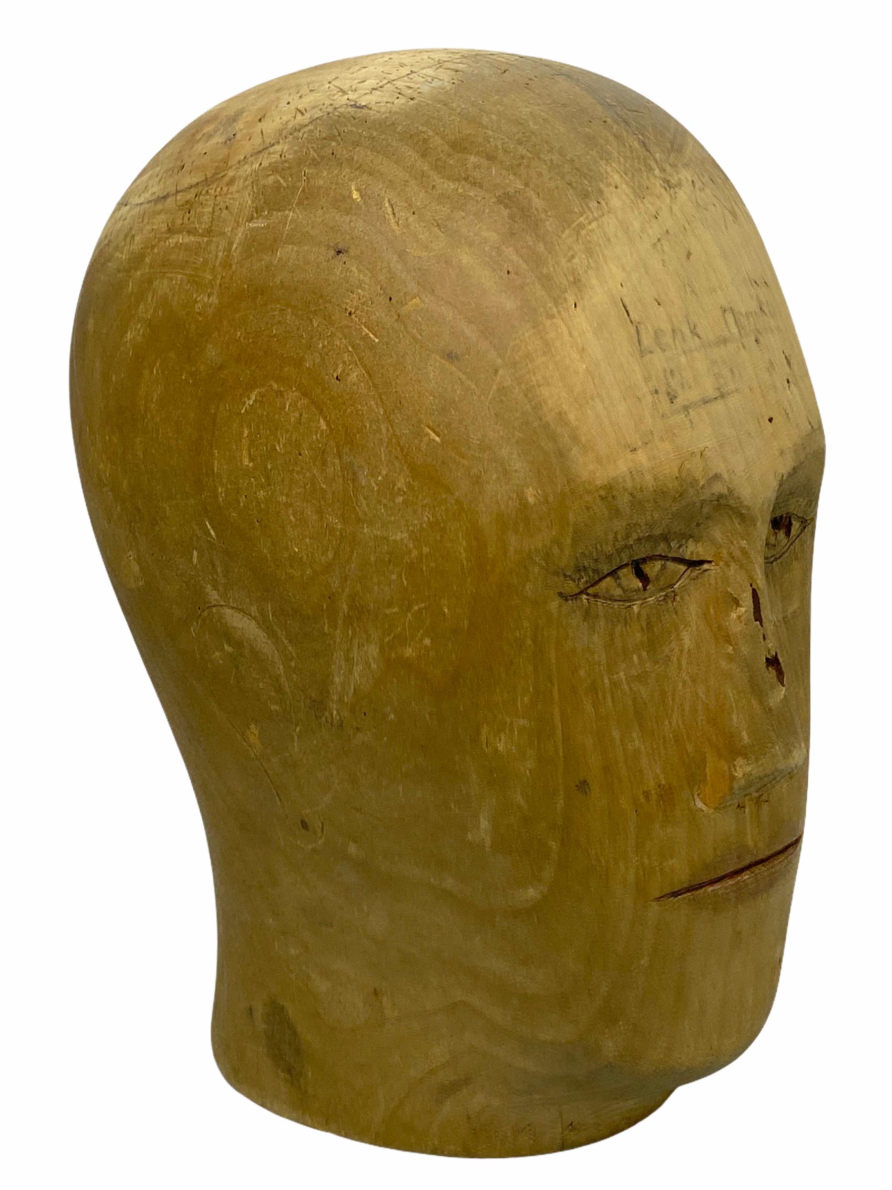 Adorable unique wood carved head. Germany, 1900s. Ideal decoration item, used in the displaying and making of hats. Hand carved from wood. Nice display piece in any room.