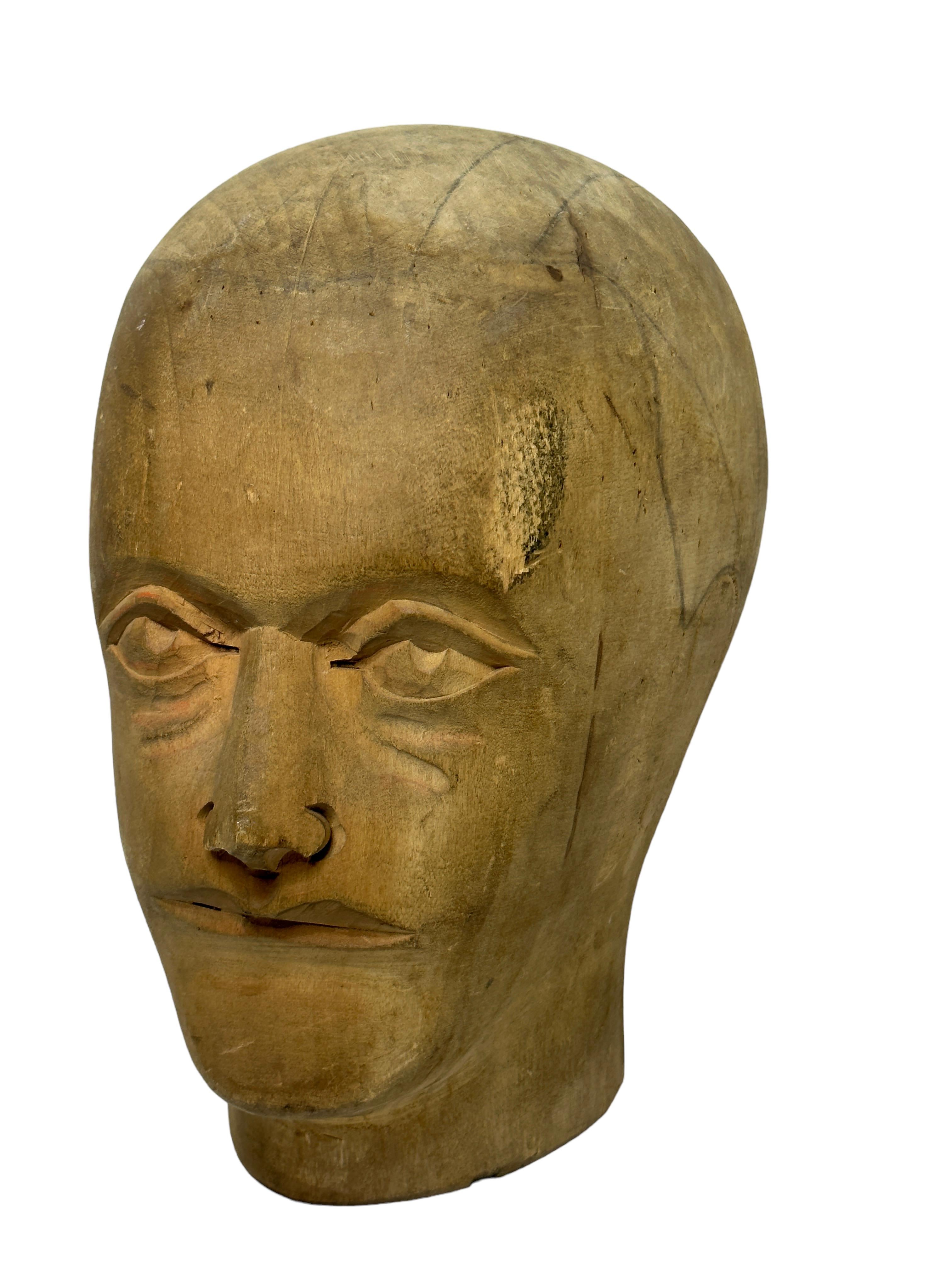 Adorable unique wood carved head. Austria, 1910s. Ideal decoration item, used in the displaying and making of hats. Hand carved from wood. Nice display piece in any room. Found at an Estate Sale in Vienna, Austria.