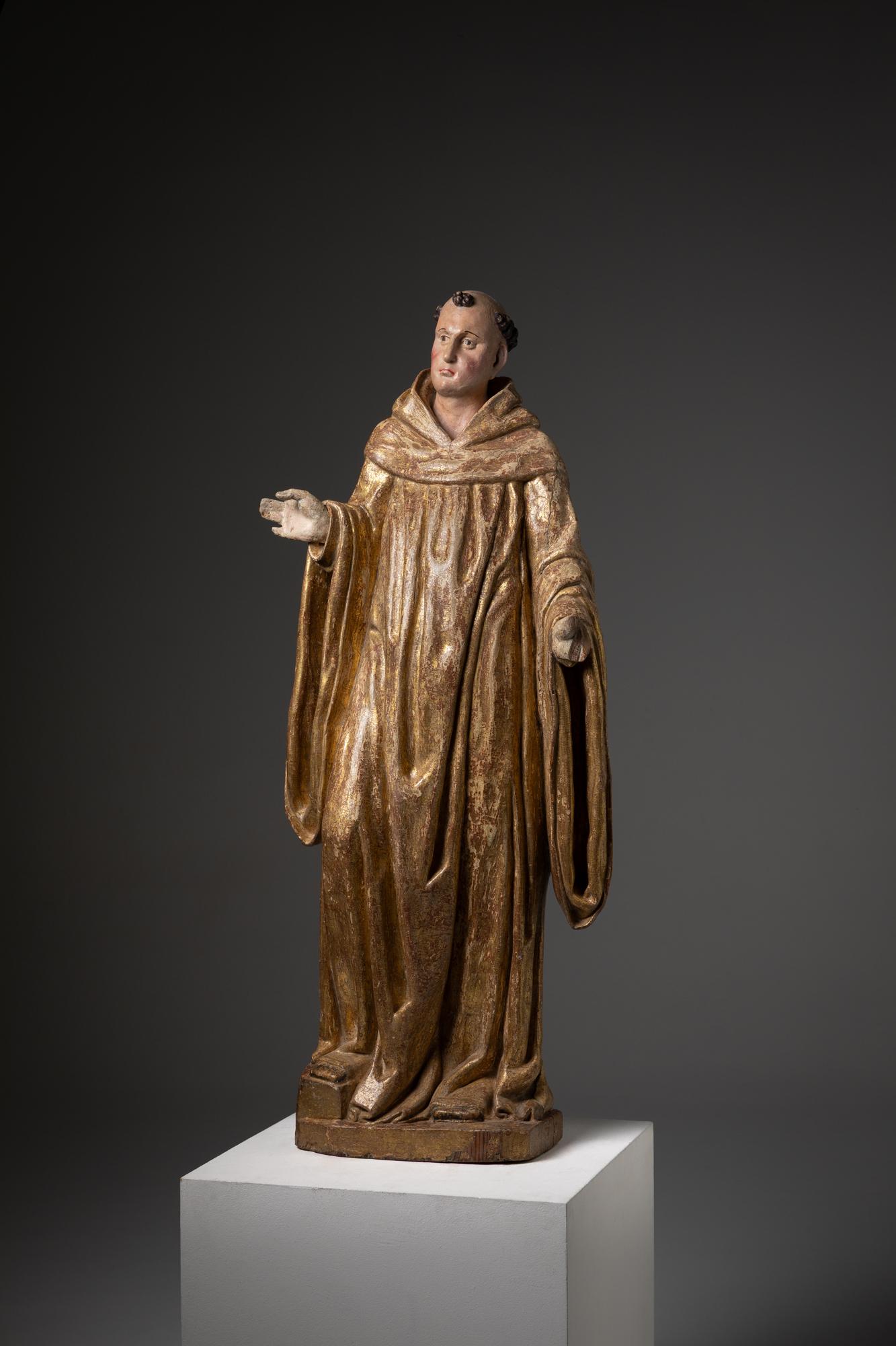 This is a finely carved wooden statue, most likely representing Saint Bernard of Clairvaux, a prominent figure in the Cistercian order. Originating from Portugal and dating back to the 17th century, the sculpture reflects the Baroque era's religious