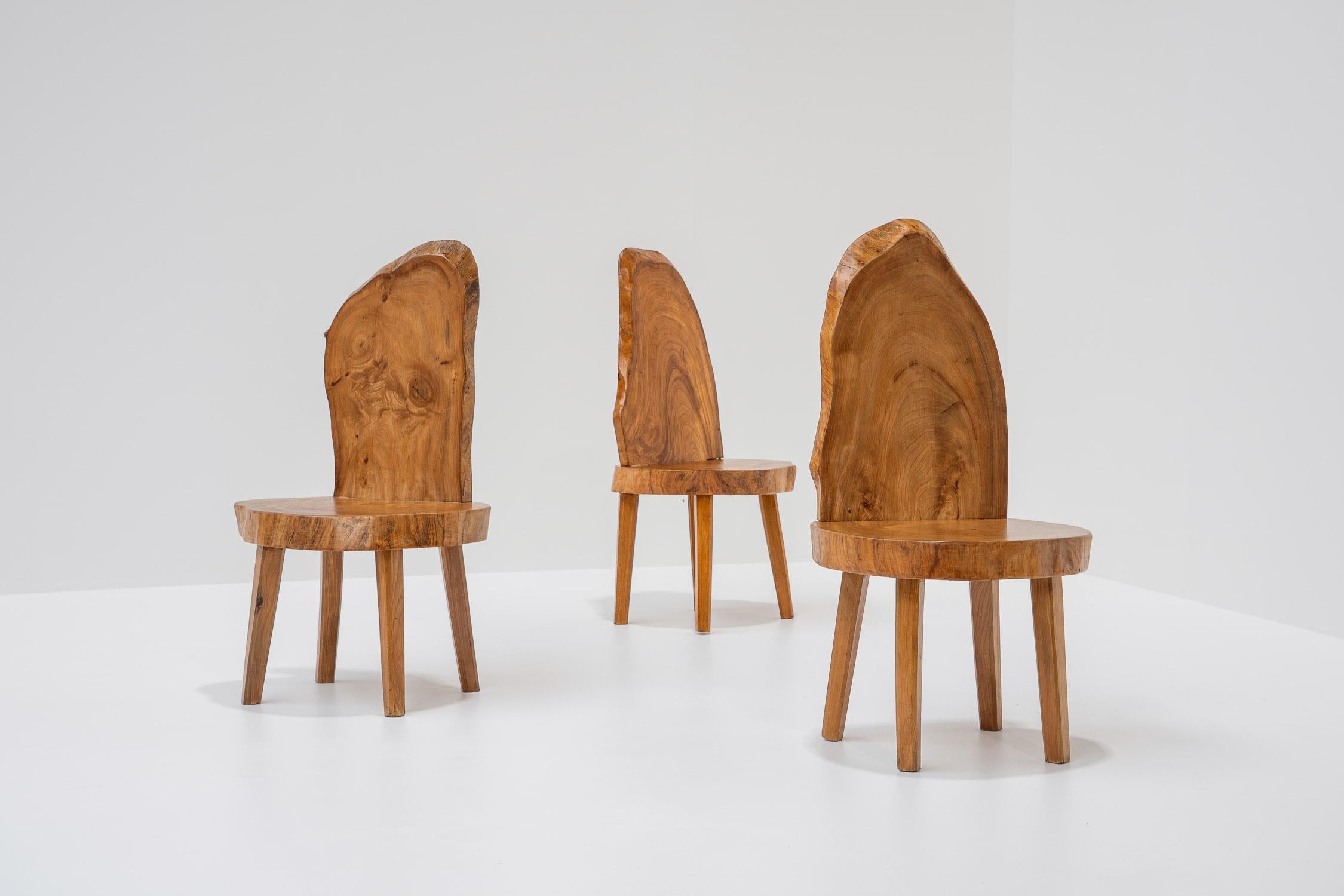 Crafted from solid tree trunks, each chair tells its own story. The natural imperfections and unique grains of the wood make no two chairs exactly alike. Each piece has its organic, live edge shape. Their imperfections make them the perfect item to