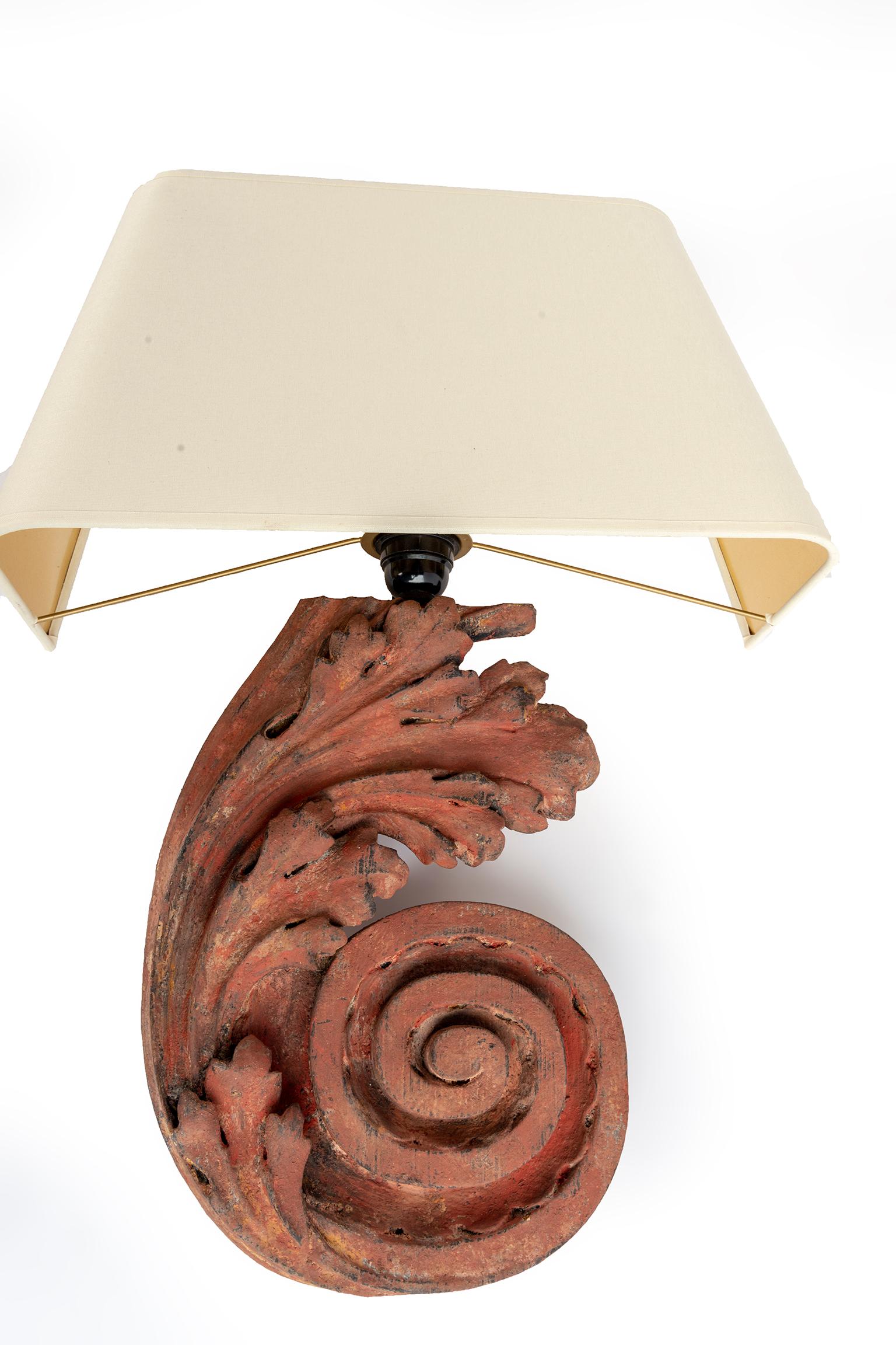 Pair of Carved wooden wall sconce in the form of an acanthus leaf with shades.