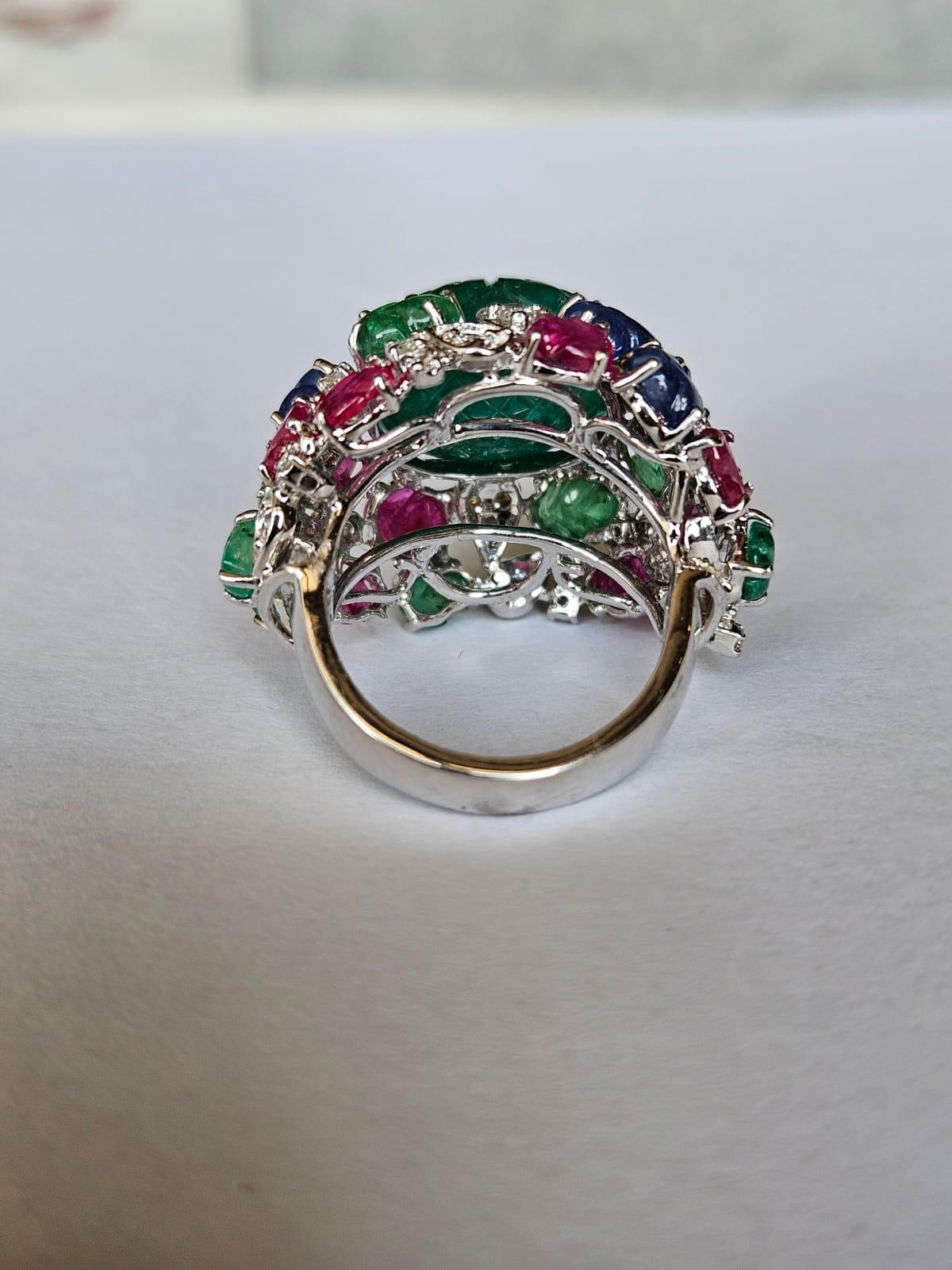 Art Deco carved Zambian Emerald, Blue Sapphire, Ruby & Diamond Tutti Frutti Cocktail Ring For Sale
