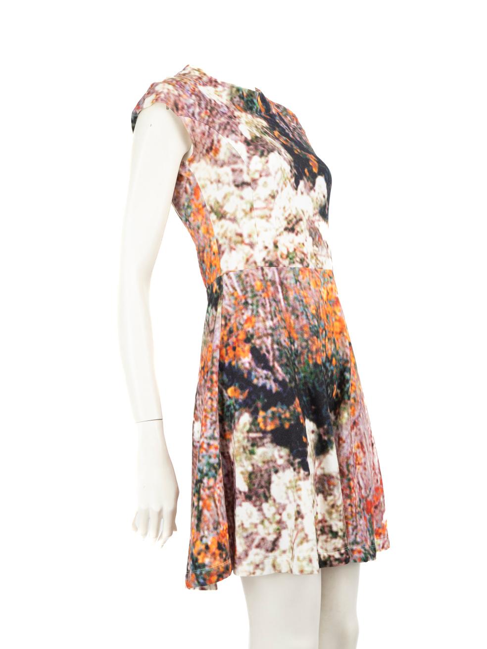 CONDITION is Good. Minor wear to the dress is evident, there is discolouration on the brand label, the internal trimming underneath the opening zip and the internal underarms. The front lining of the dress has a small mark on this used Carven