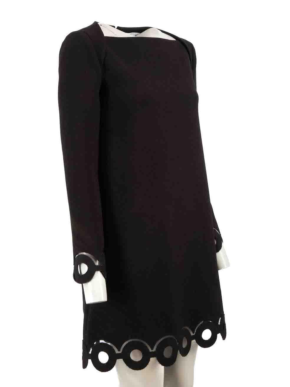 CONDITION is Very good. Minimal wear to dress is evident. Minimal pulls to overall fabric and minor fraying to hemlines on this used Carven designer resale item.

Details
Black
Synthetic
Dress
Mini
Long sleeves
Square neck
Cut out ring hem and cuff