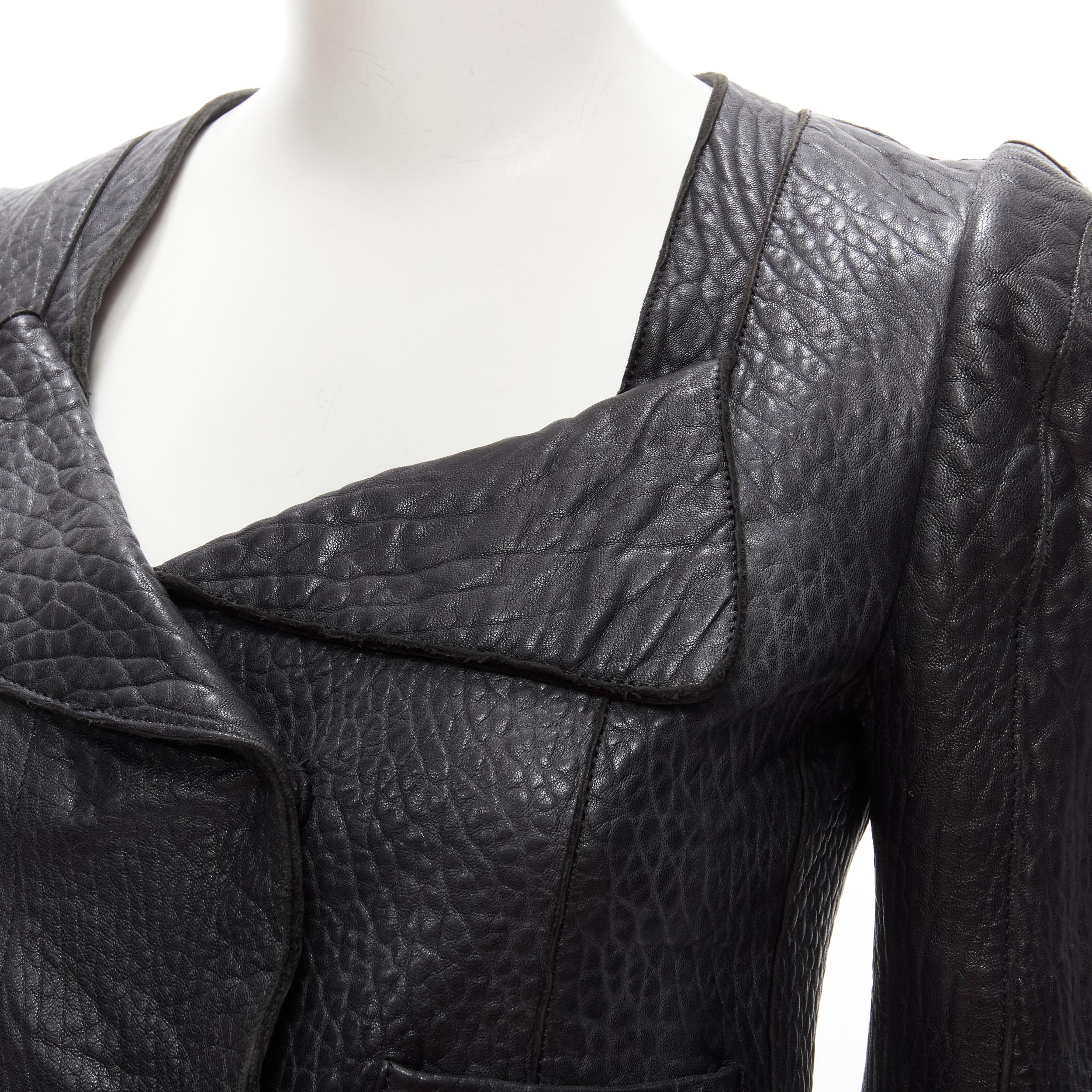 CARVEN black textured leather padded shoulder double breasted blazer IT38 XS
Brand: Carven
Extra Detail: Croc pattern pebble textured leather. Wide foldover collar. Double breasted snap button. Double patch pocket at waist. Padded