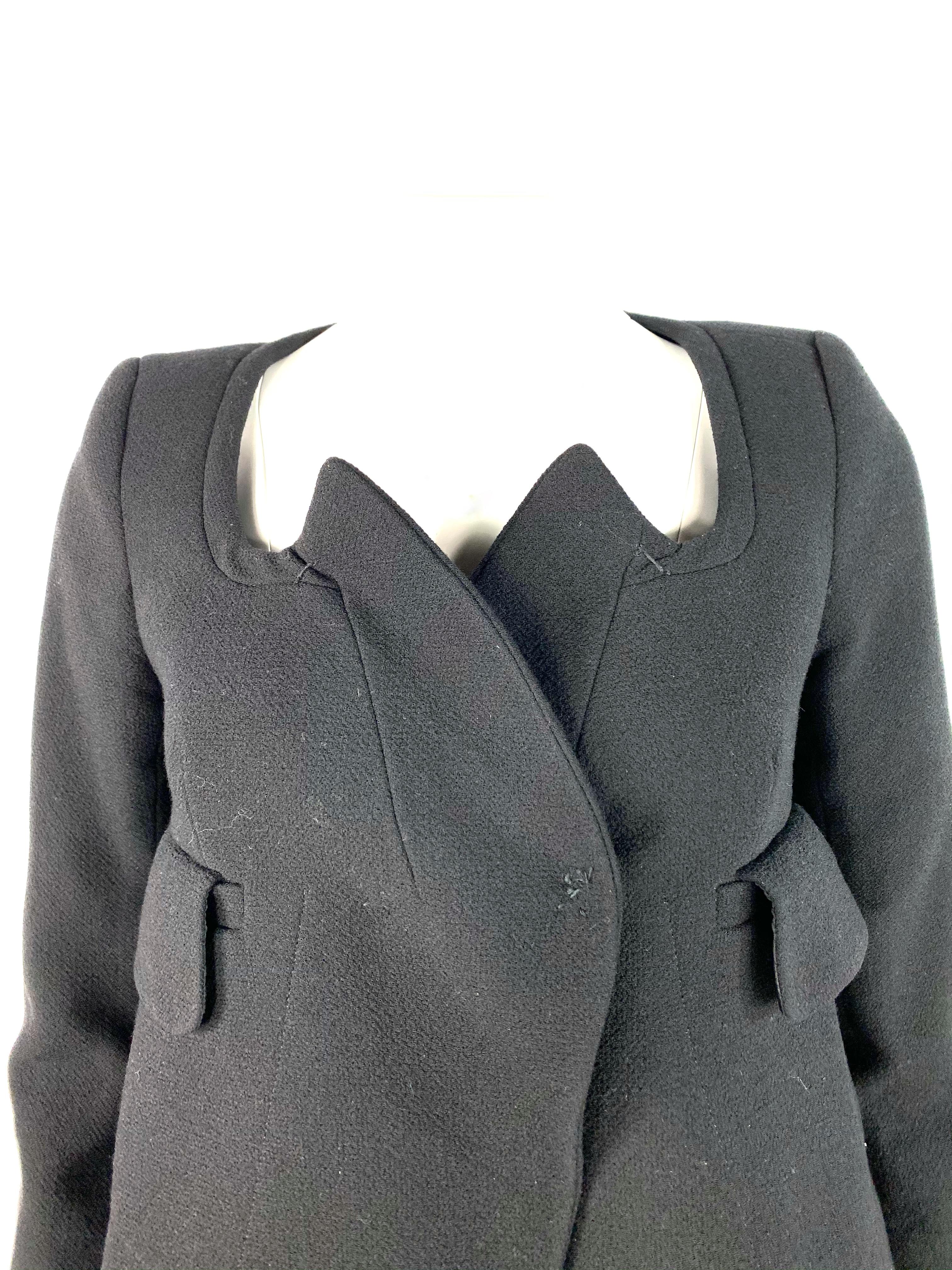 Product details:

Featuring wool blend, blazer jacket with collar, front dual pockets, 3/4 sleeves and front click in button closure. The skirt feature flare style with rear silver tone hardware zip closure and mini length.
Made in Hungary. 