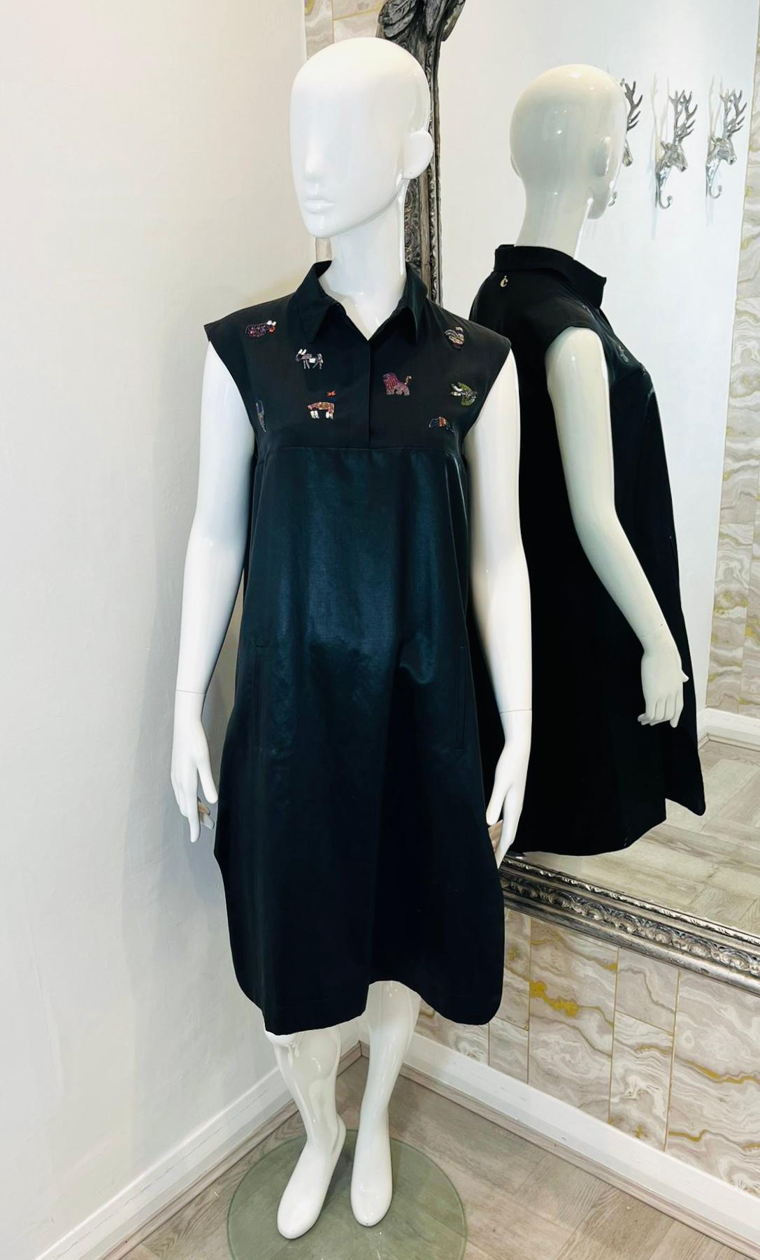 Carven Embroidered Silk & Cotton Dress

Black, sleeveless dress designed with shirt style, collared top detailed with multicoloured, crafted with beads and threads animals embroidery.

Featuring empire silhouette with plain, loose fit skirt styled