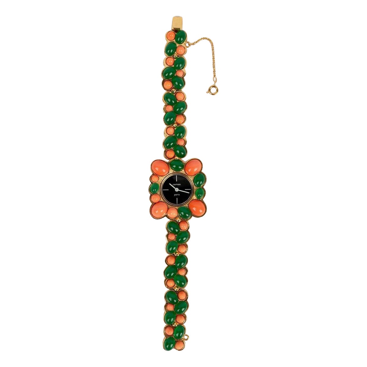 Reloj Carven de metal dorado pavimentado con cabujones de pasta de vidrio, años 60
