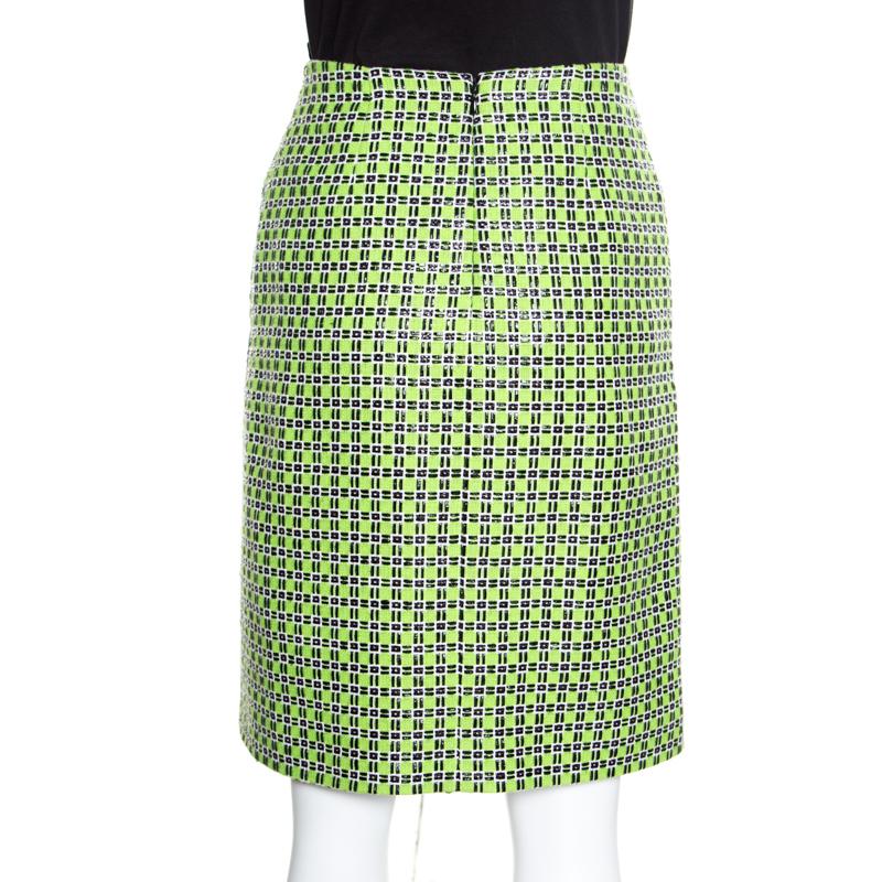 Club this Carven skirt with your favorite top and step out in a chic and classy look. Make a mark with this alluring kiwi green piece adorned with a checkered pattern all over. Make an everlasting impression with this skirt crafted from a cotton