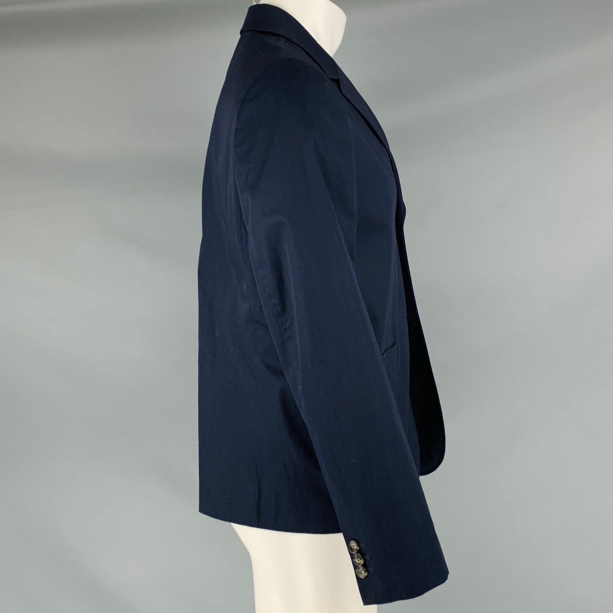 CARVEN jacket
in a
navy cotton fabric featuring a single-breasted style, notch lapel, and double button closure. Made in Hungary.Excellent Pre-Owned Condition. 

Marked:   50 

Measurements: 
 
Shoulder: 18 inches Chest: 40 inches Sleeve: 26 inches